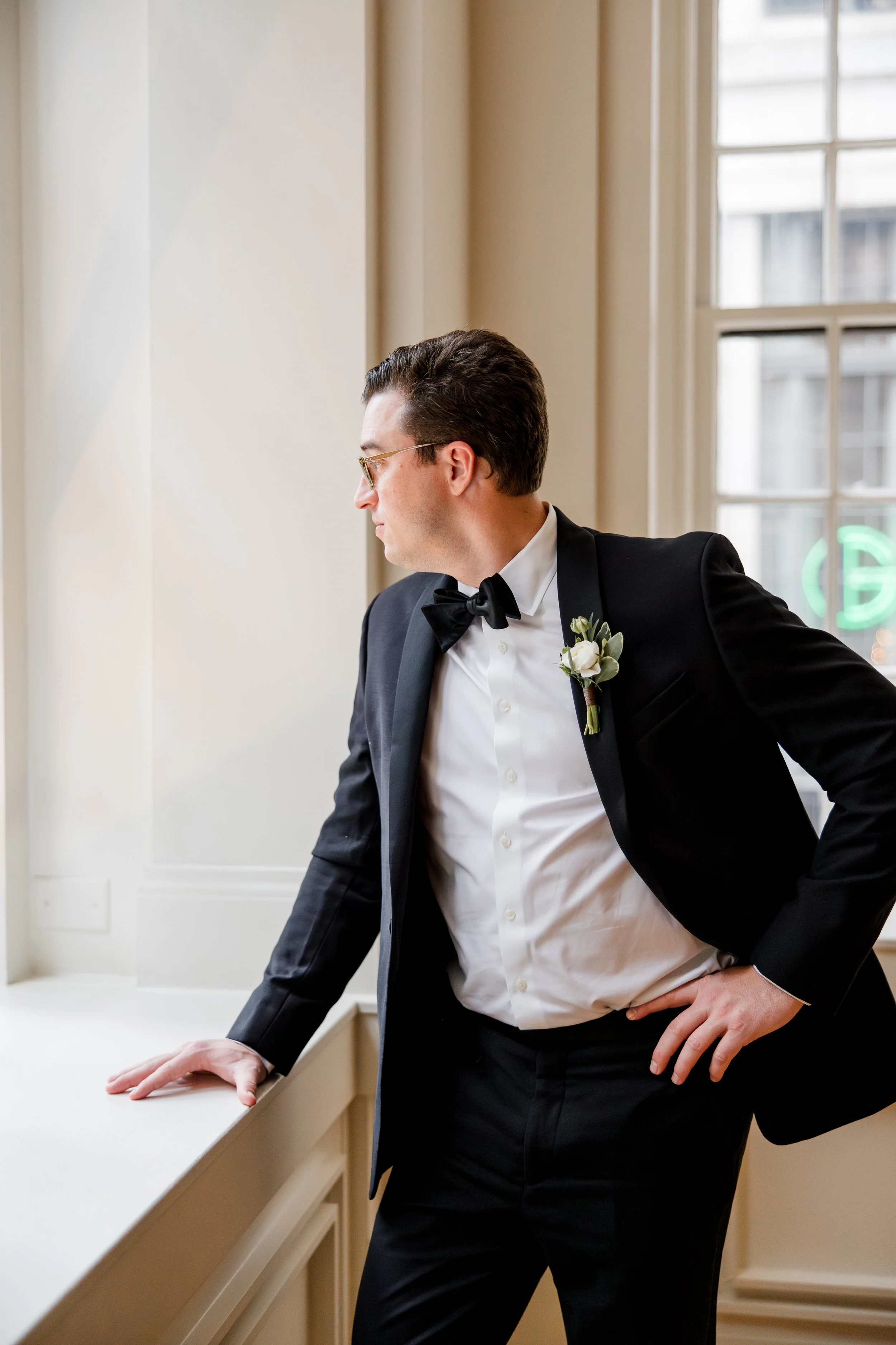 groom-looking-out-window.jpg