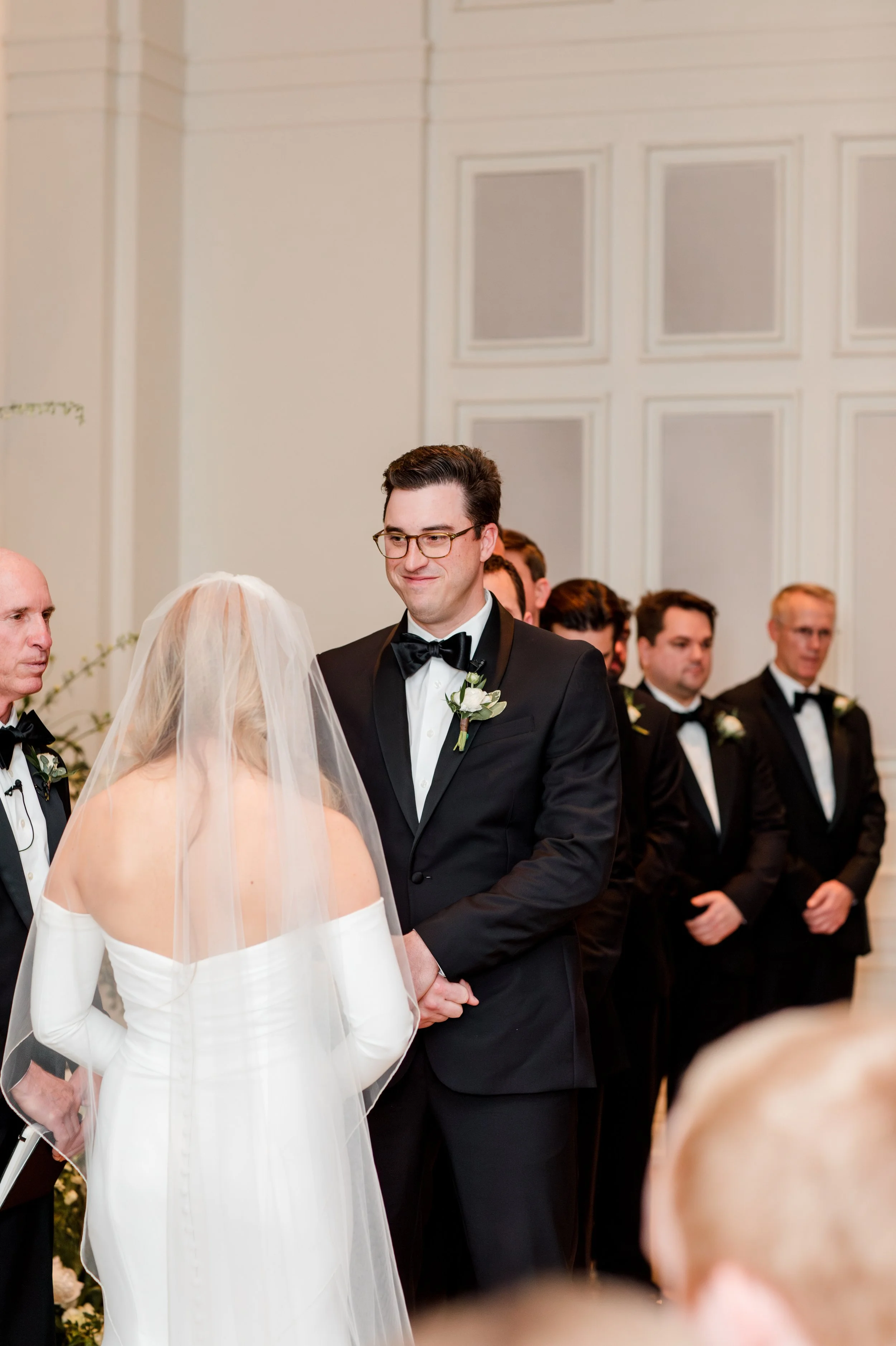 groom-smiling-at-bride-during-ceremony.jpg