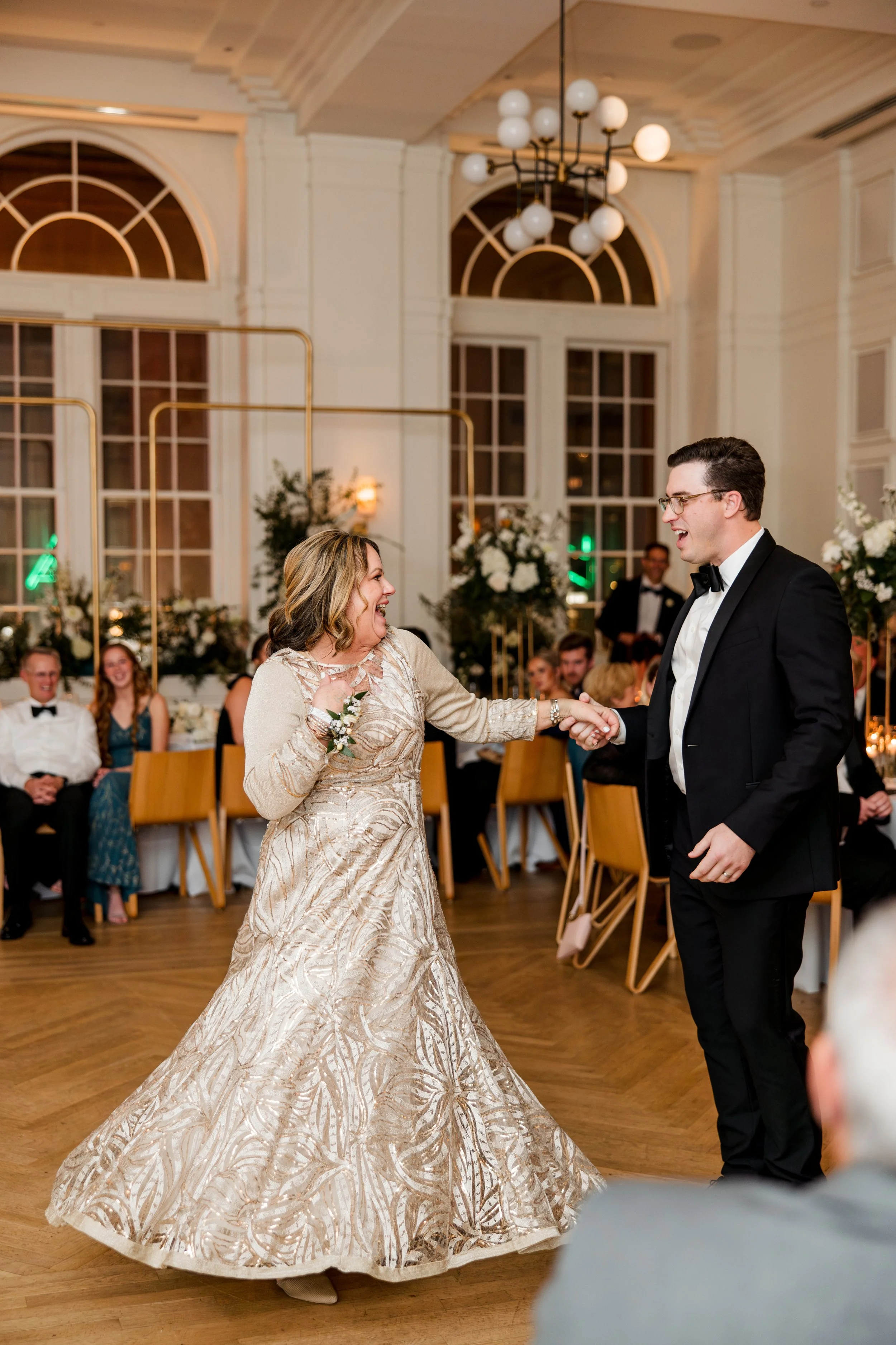 groom-twirling-mom-at-reception.jpg