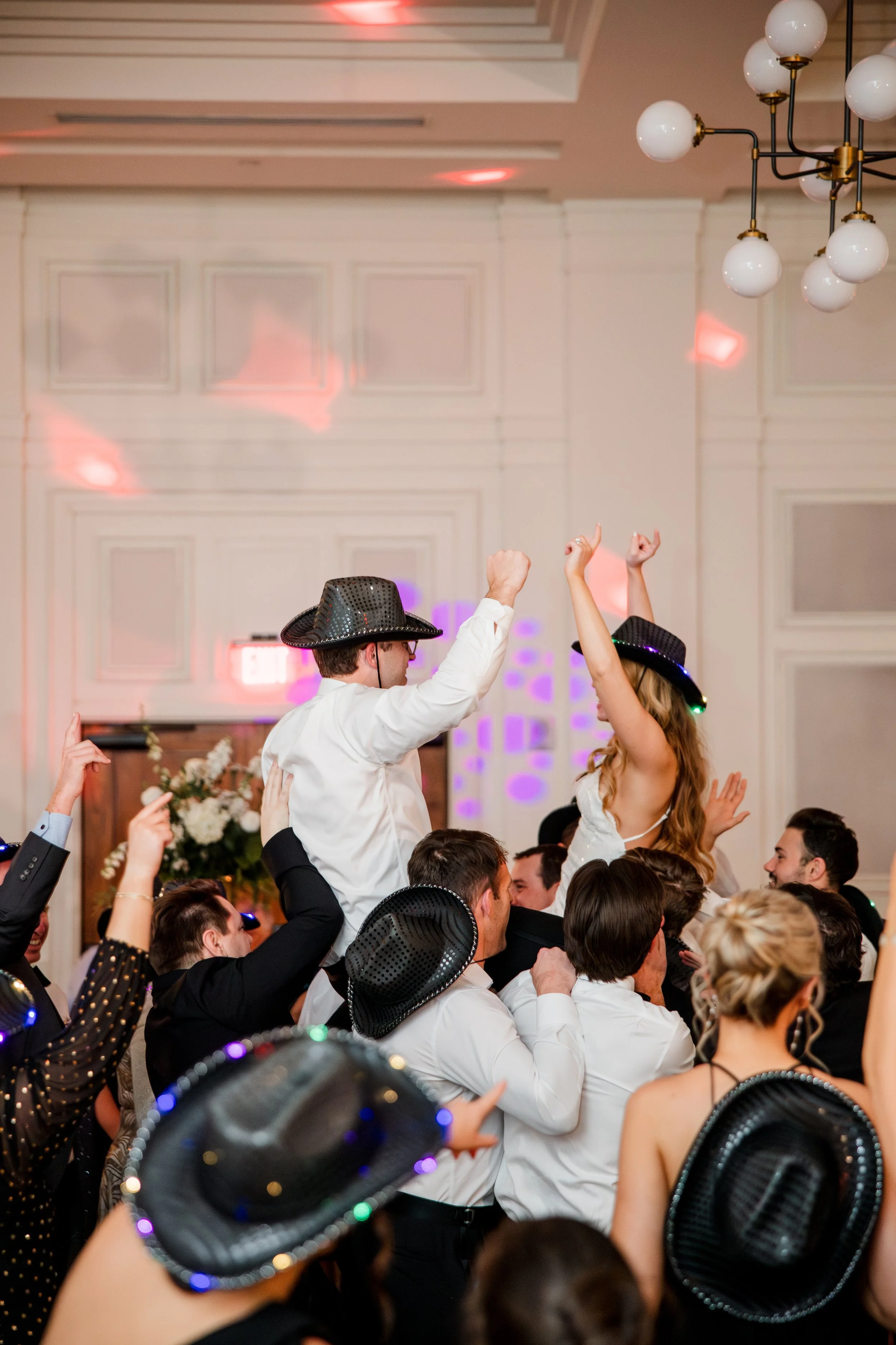 guests-lifting-bride-and-groom.jpg