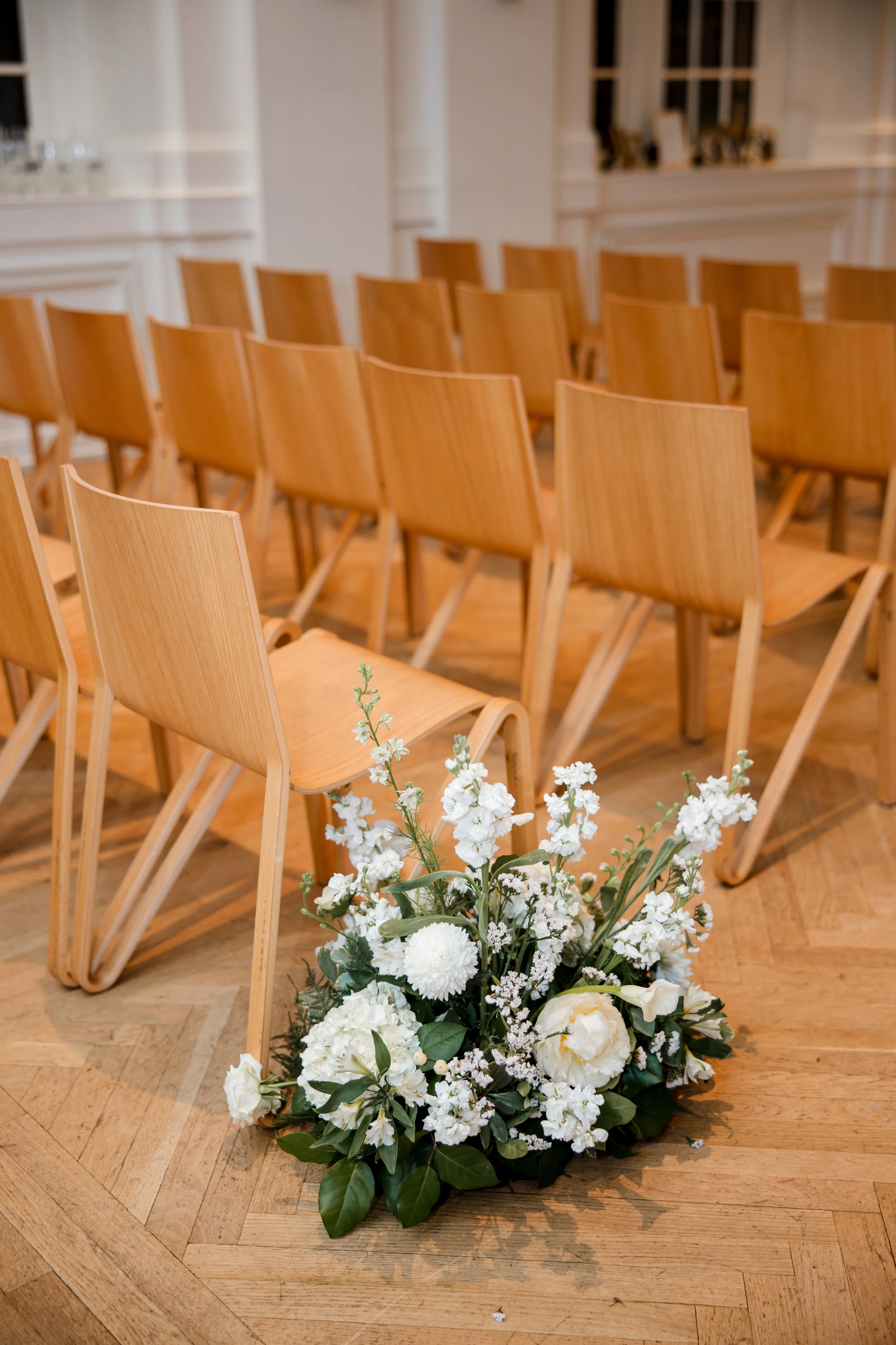 white-floral-arrangement-in-aisle.jpg