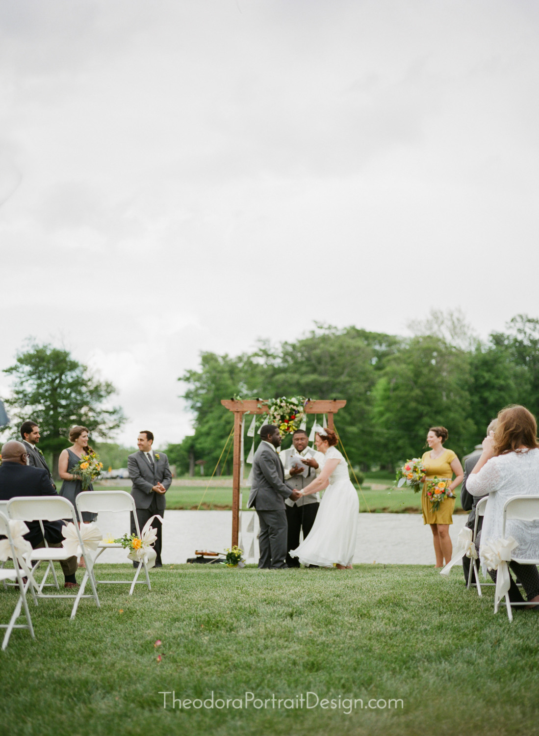  bride and groom during the wedding ceremony      www.TheodoraPortraitDesign.com   film wedding photography 