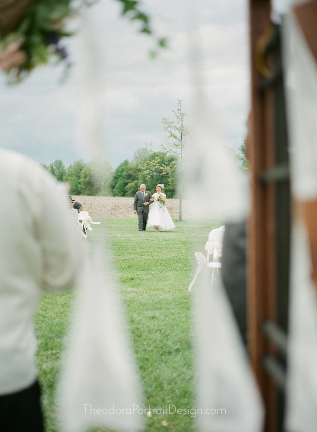  father and daughter walking down the aisle      www.TheodoraPortraitDesign.com   film wedding photography 