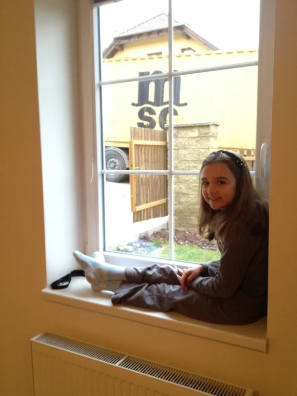 Hannah is watching them unload from inside--too cold out there! 