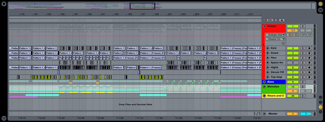 Highlight the tracks you want to group and press Command G. You will know certain tracks are grouped together because they will be flanked by a band on the left of the mixer in Arrangement View. Look at the red band along the right side of the Kick, Snare and Perc tracks 