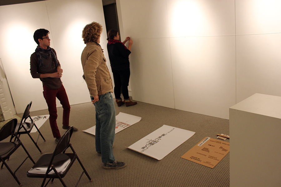  matthew vargas, bryan burke, and hillary schmitz help set up the show. 