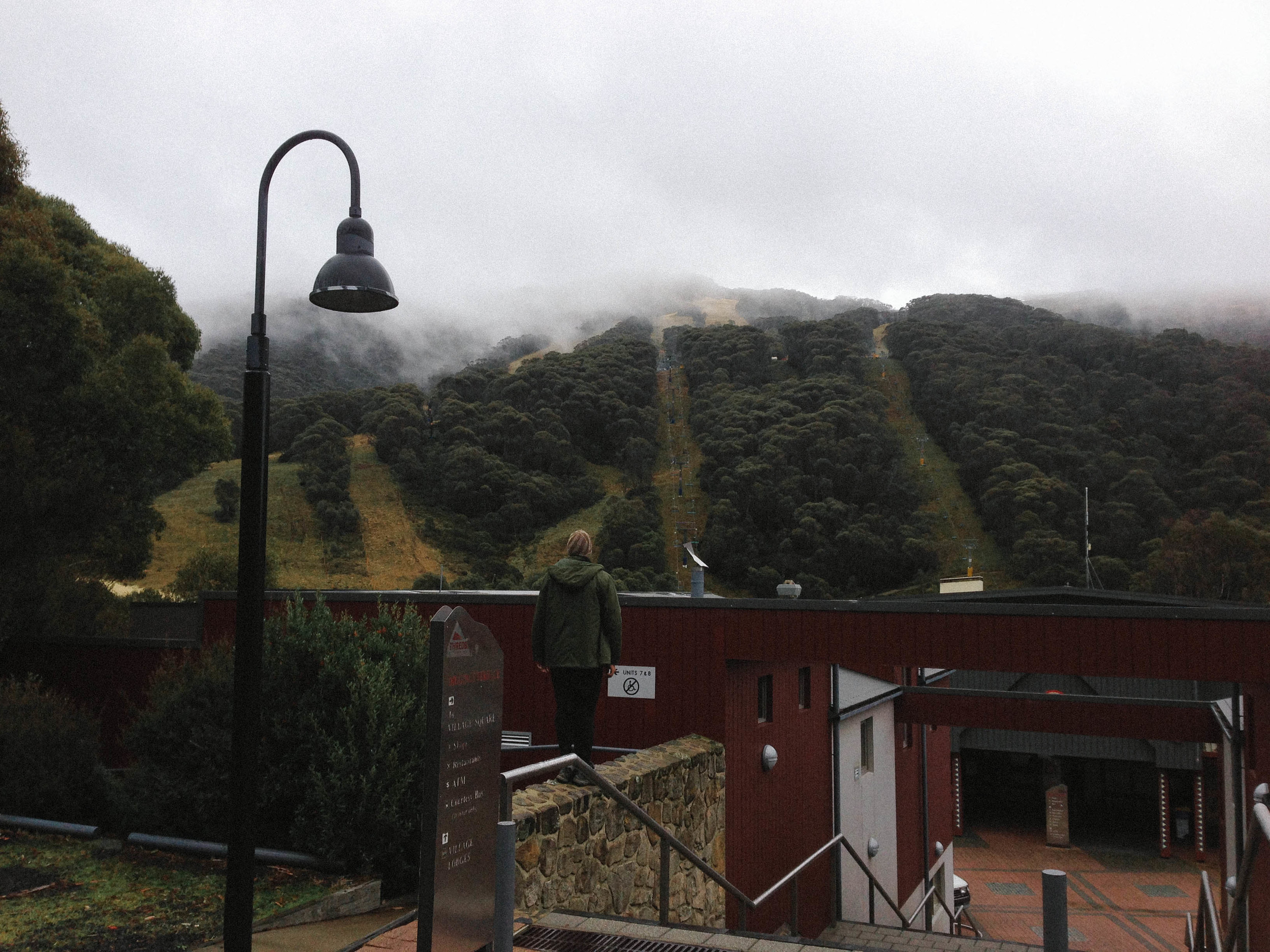 Jonny in Thredbo, looking at the snowless ski fields.