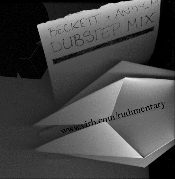 A paper bag with a handwritten label "Beckett + Andy M. Dubstep Mix" and a printed website URL "www.virb.com/rudimentary".