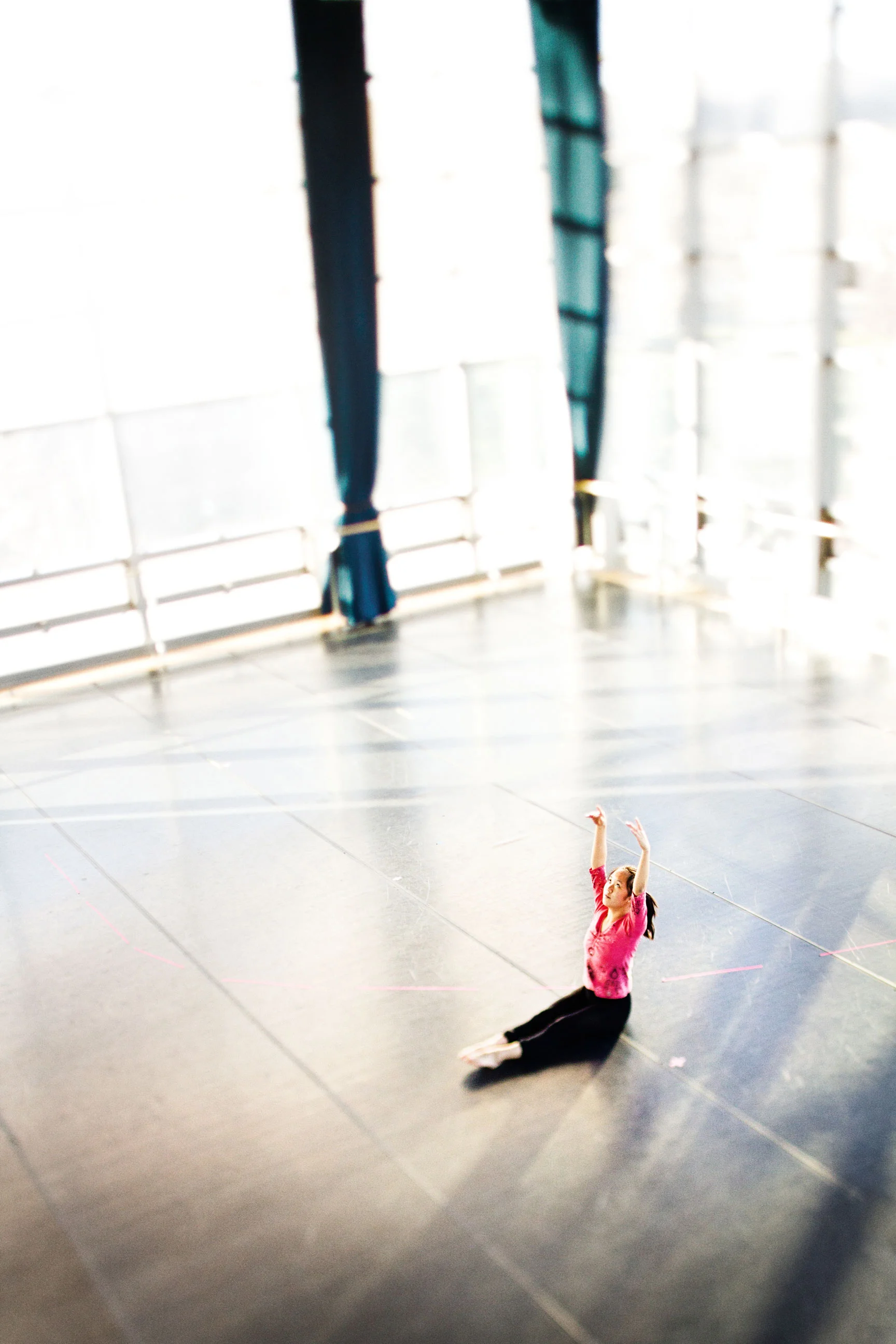 A dance student warms up before class