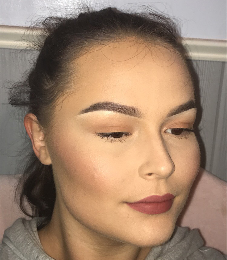 Complete your look by adding glow to the high points of your face, some soft eyeshadow, and lip color. 