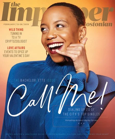 Cover of the Improper Bostonian Bachelor/Bachelorette issue featuring an animated woman gesturing a phone call under the headline "Call Me!"