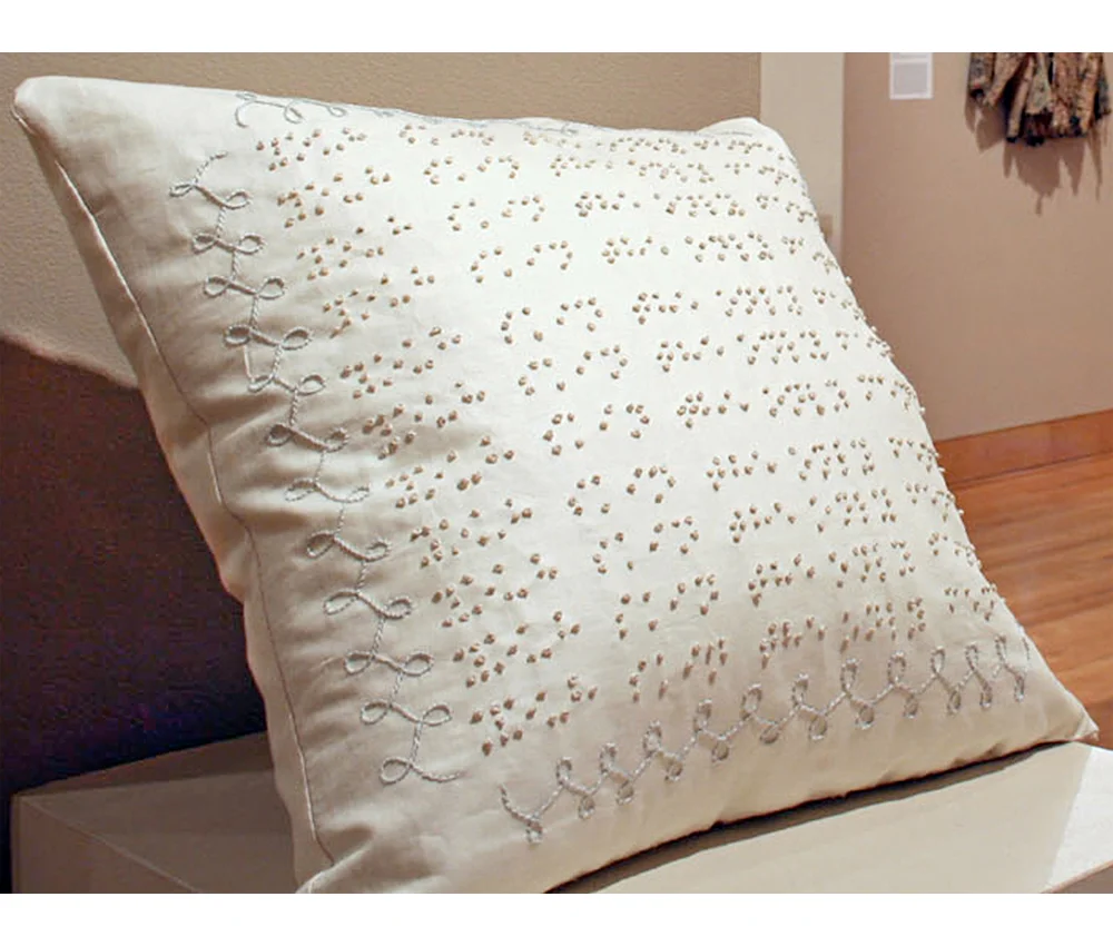 Braille Pillow - 2007, hand embroidery on cotton, down pillow. Collection of the artist.