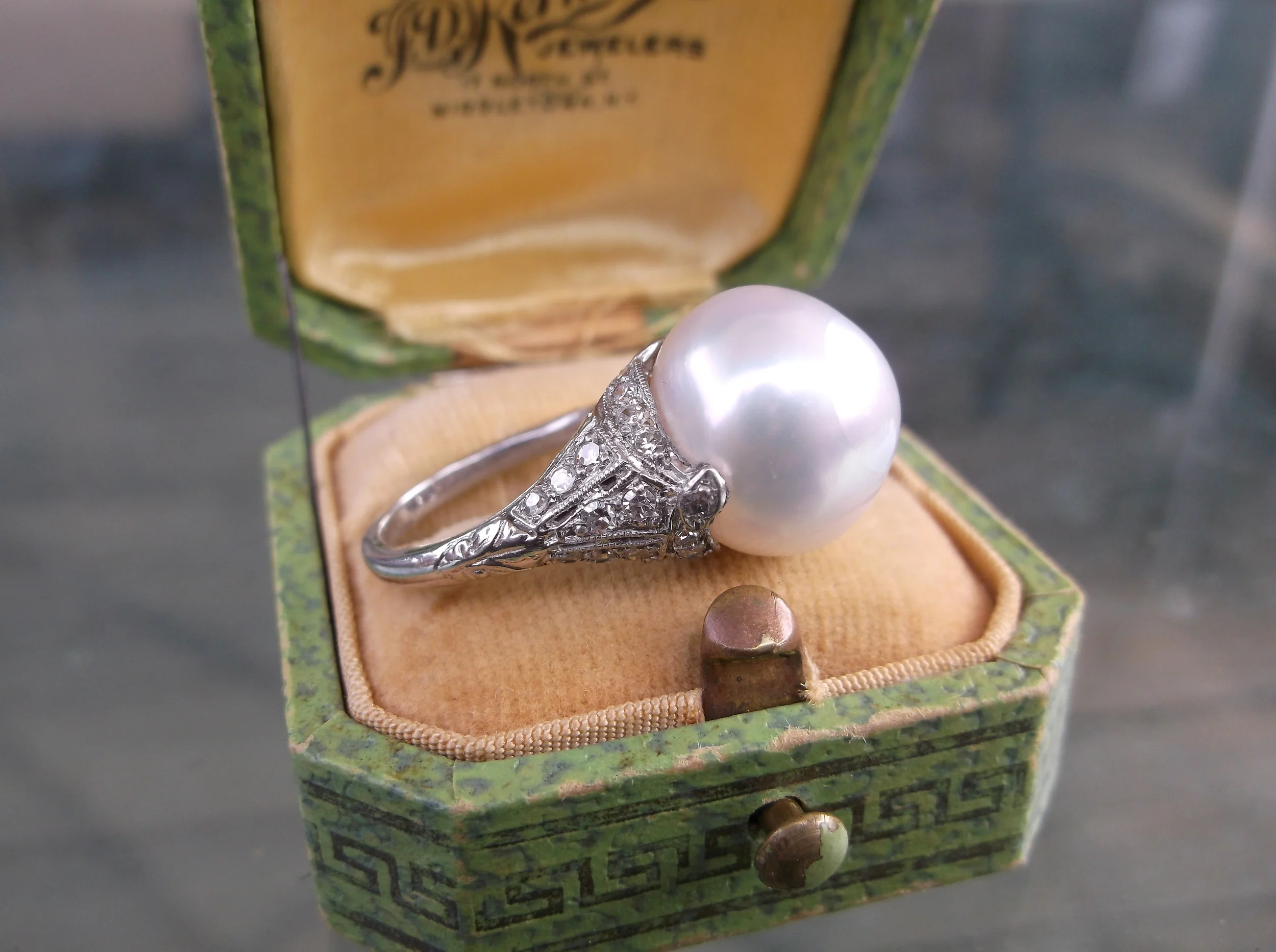 SOLD - Art Deco inspired large south sea pearl set in a platinum mounting with beautiful diamond detail.