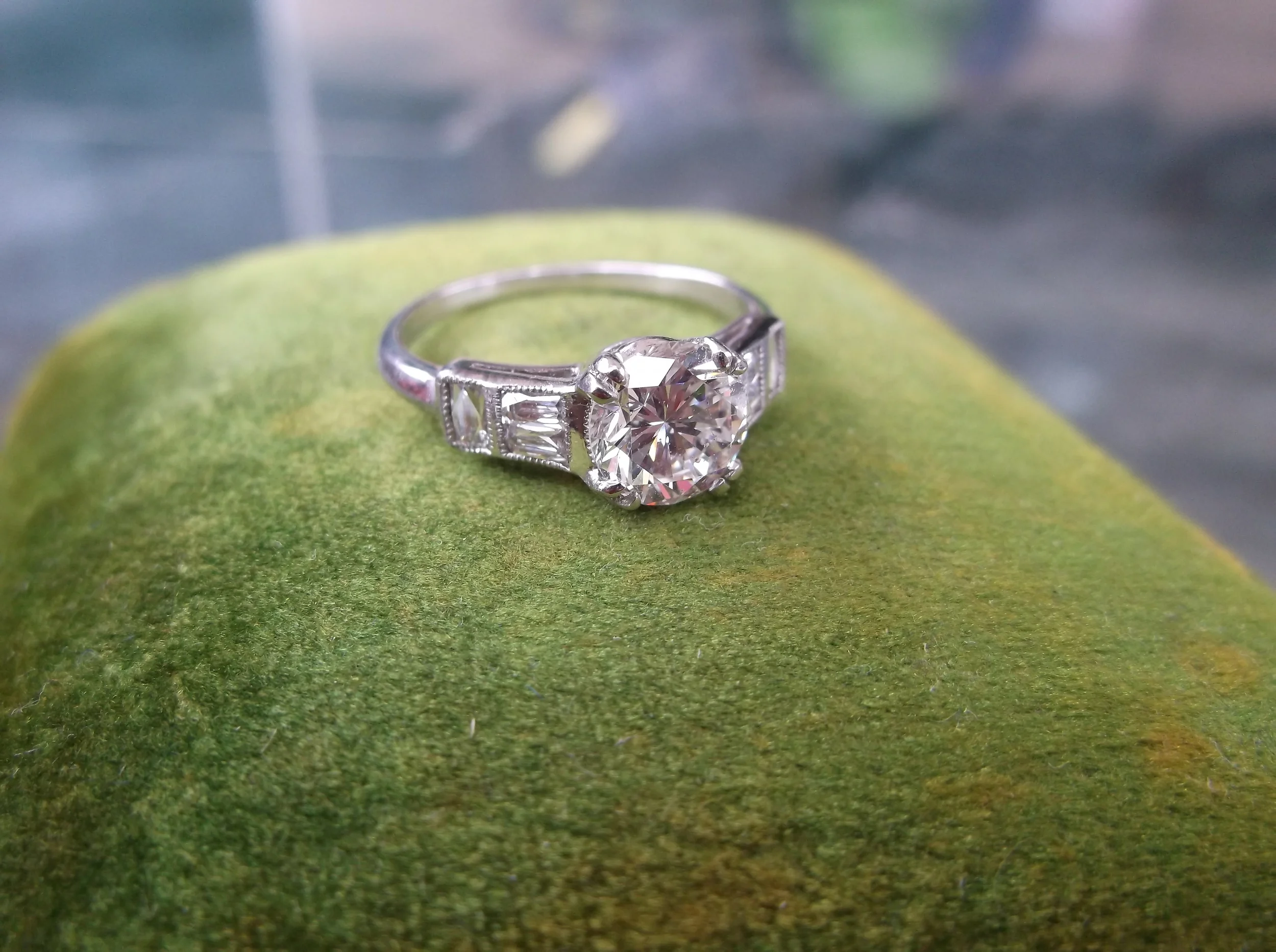 SOLD - 1930's 1.20 carat diamond ring with three superb swiss cut diamonds on each side.