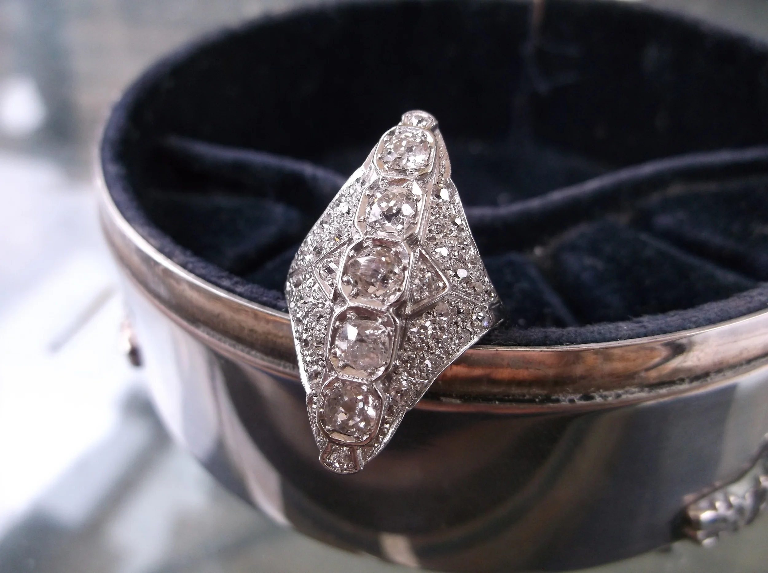 SOLD - Enchanting 1920's Old Mine Cut diamond ring with 1.35 carats total weight in diamonds.