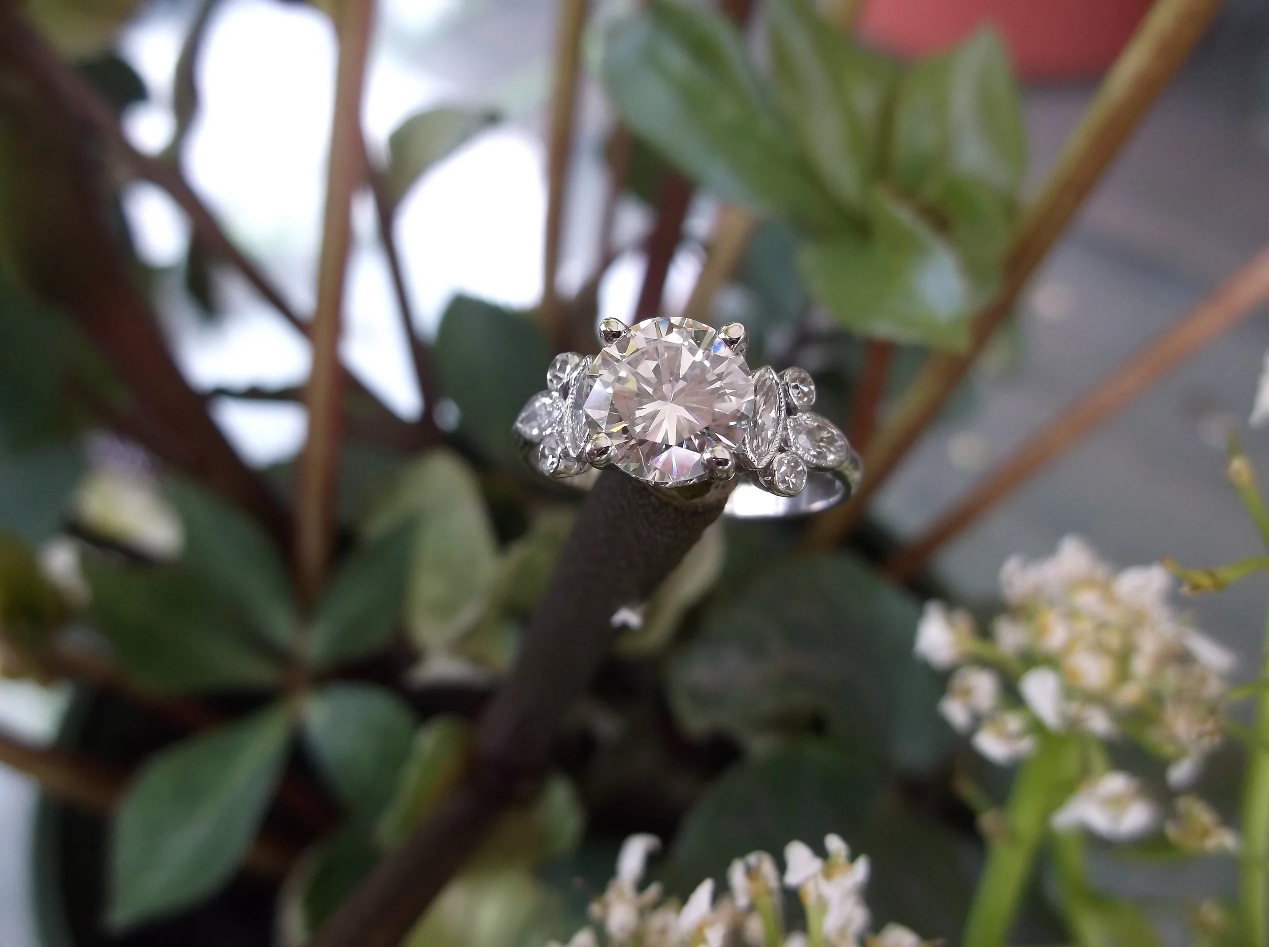 SOLD - Jaw dropping 1.55 carat Round Brillant diamond set in a beautiful marquis and round diamond mounting.