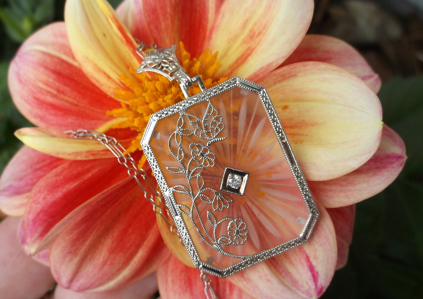 SOLD - Lovely 1920's carved quartz necklace with a small Old Mine cut diamond in the center on a dainty detailed white gold chain. (Pendant is approximately 1.25" by 1")