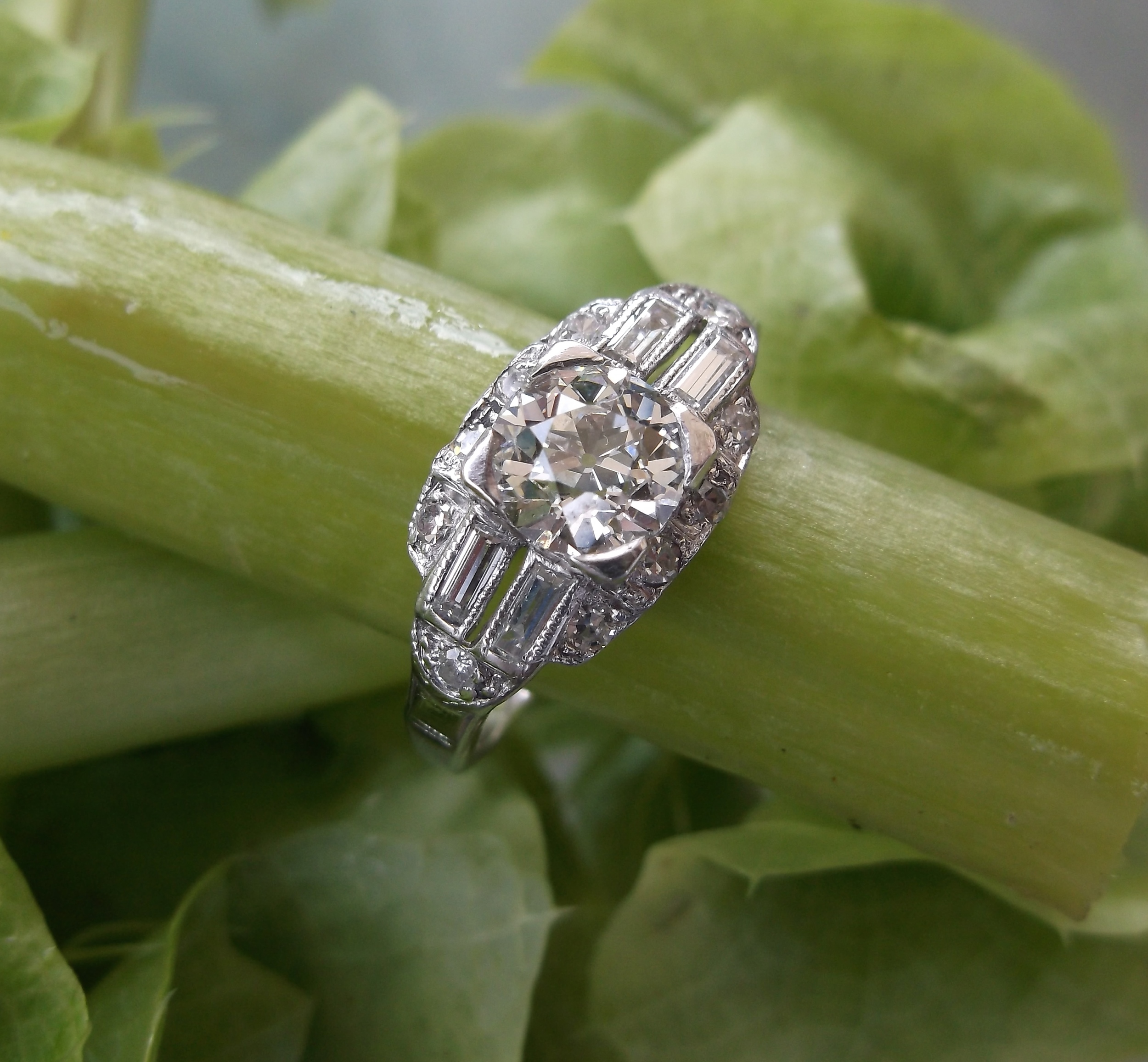 SOLD - Classic Art Deco 0.70 carat Old European cut diamond set in platinum ring with round and baguette diamond detail. 