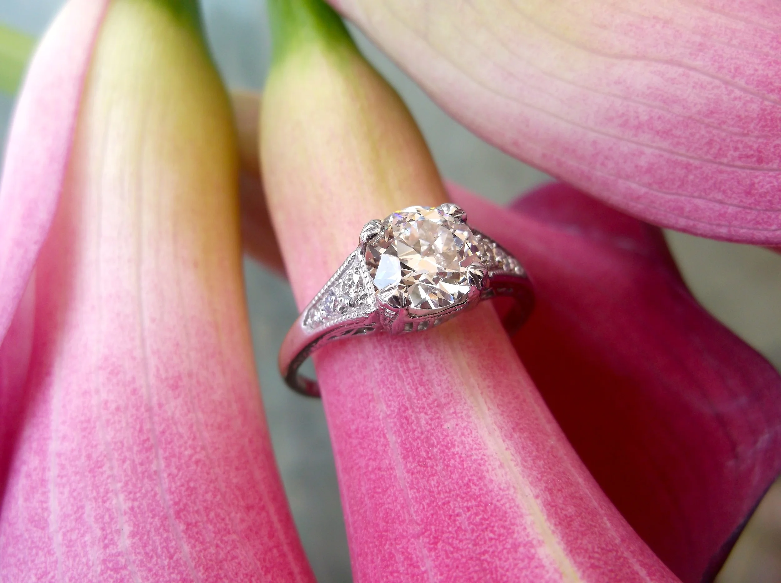 SOLD - Exquisite 1920's 1.30 carat Old European cut diamond set in a beautiful diamond and platinum mounting.