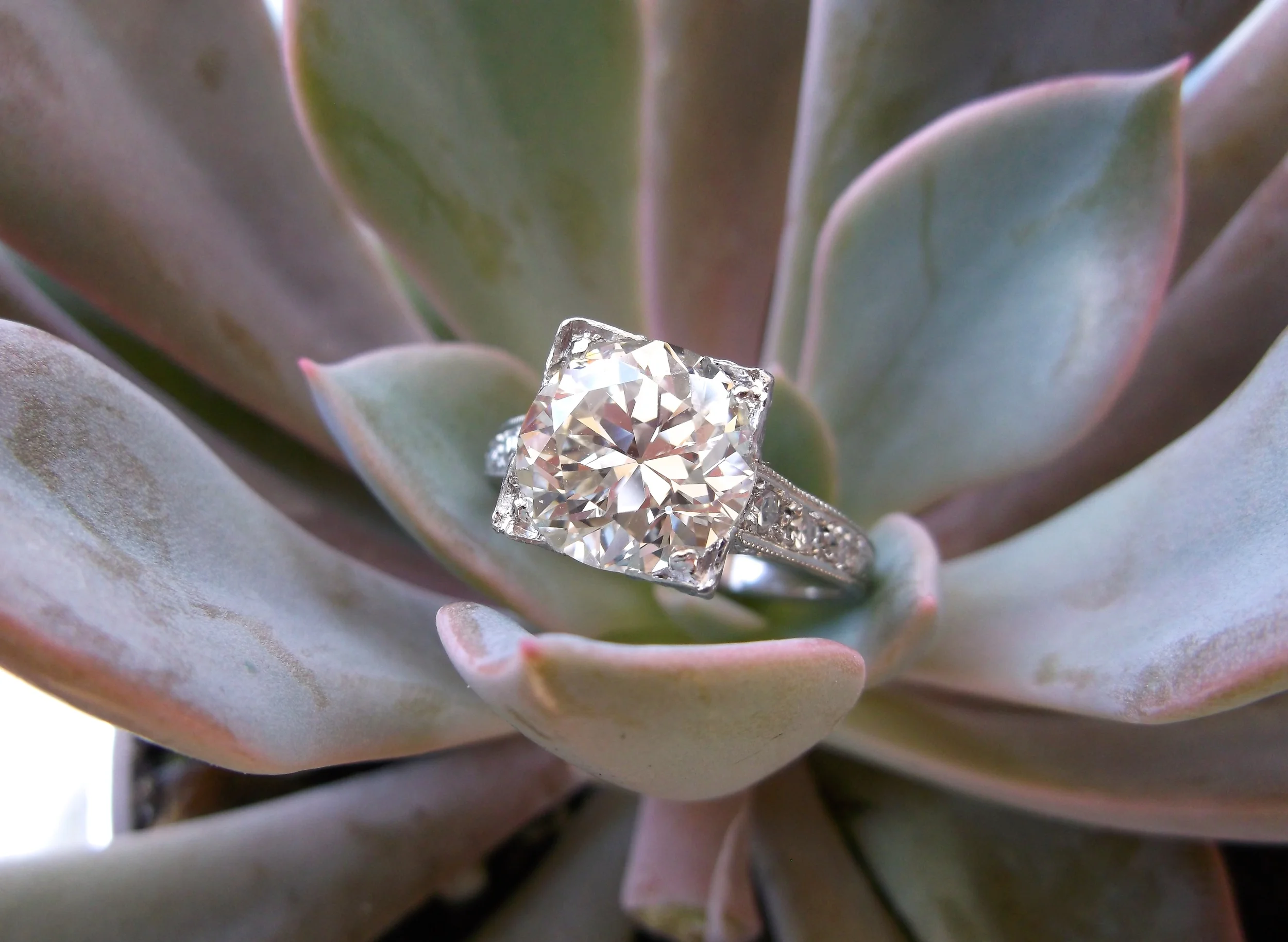 SOLD - An Art Deco knockout! 3.04 carat Old European cut diamond set in a diamond and platinum mounting. 