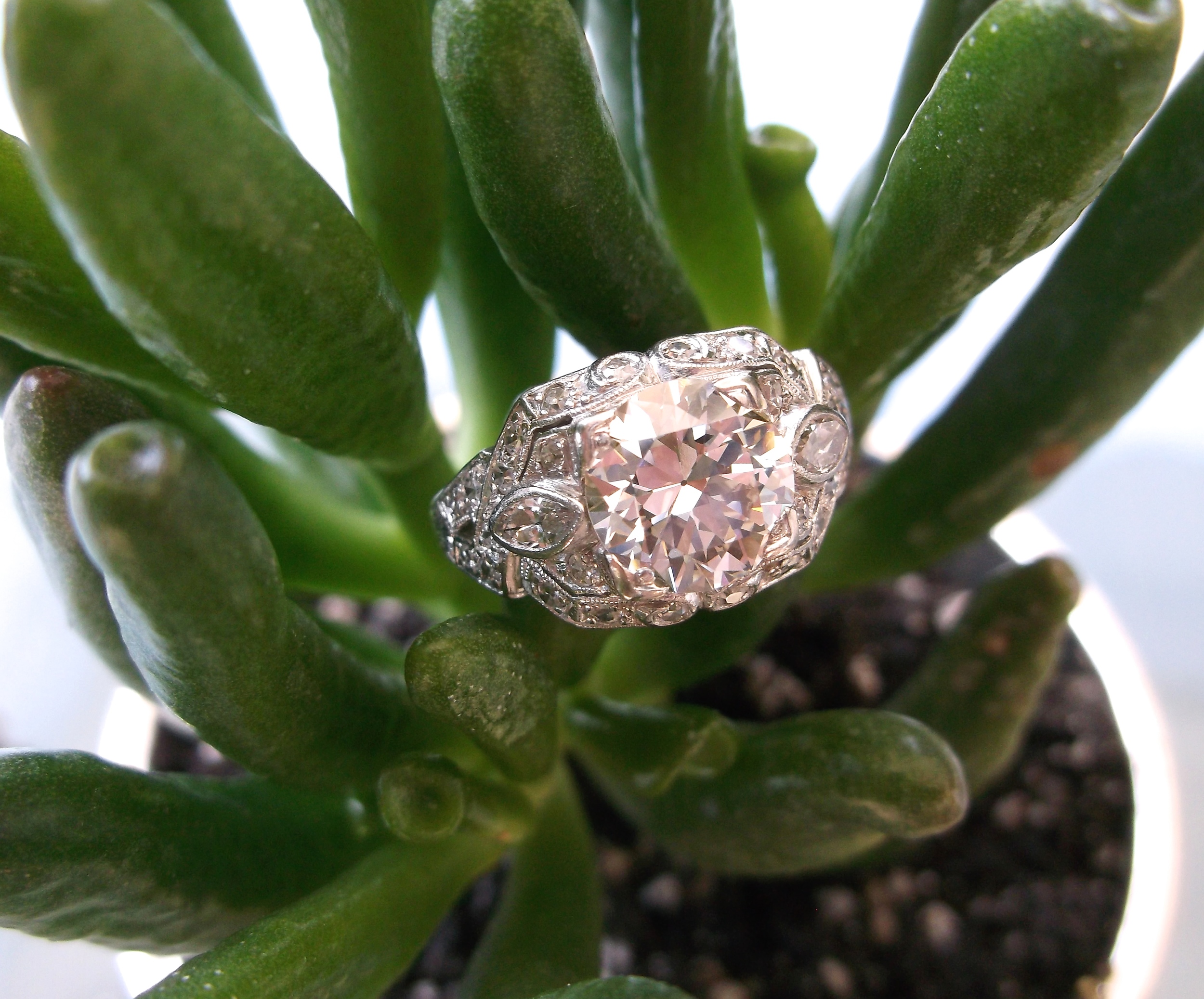 SOLD - Gorgeous all original 1920's 1.94 carat Old European cut diamond set in a beautiful platinum and diamond detailed mounting.