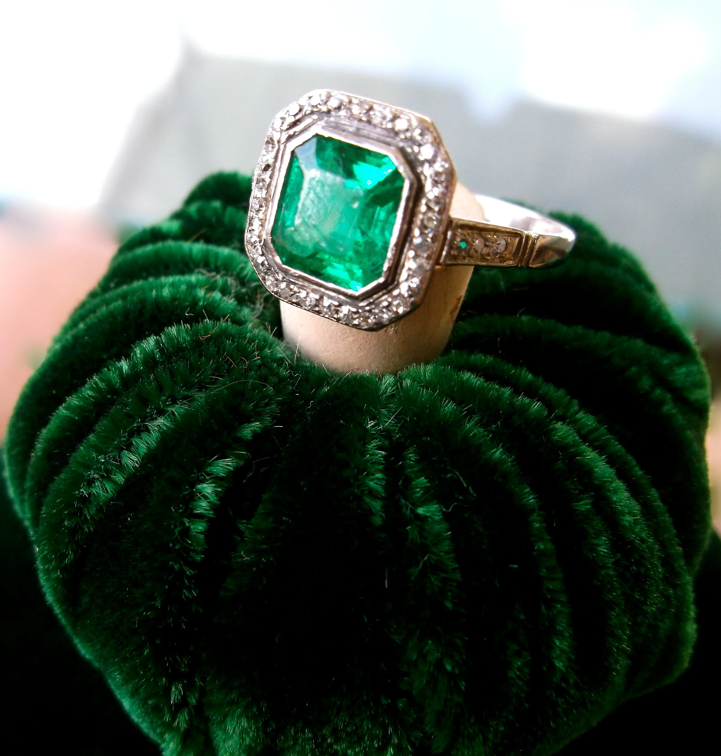 SOLD - Striking 1920's 1.25 carat emerald ring with 0.20 carats total weight in diamonds set in platinum. 