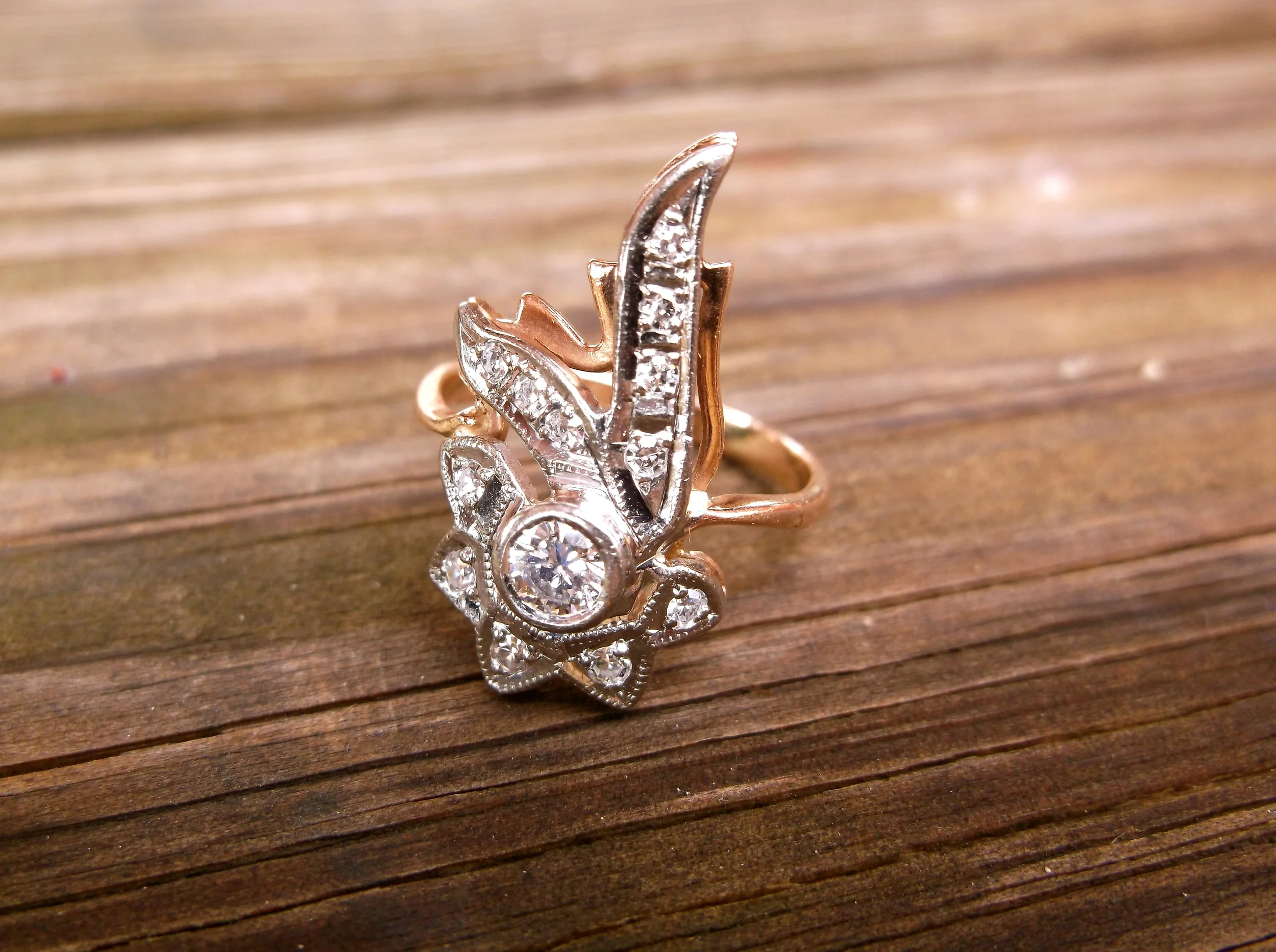 SOLD - 1940's retro rose gold and white gold elongated diamond ring with a 0.15 carat diamond in the center. 