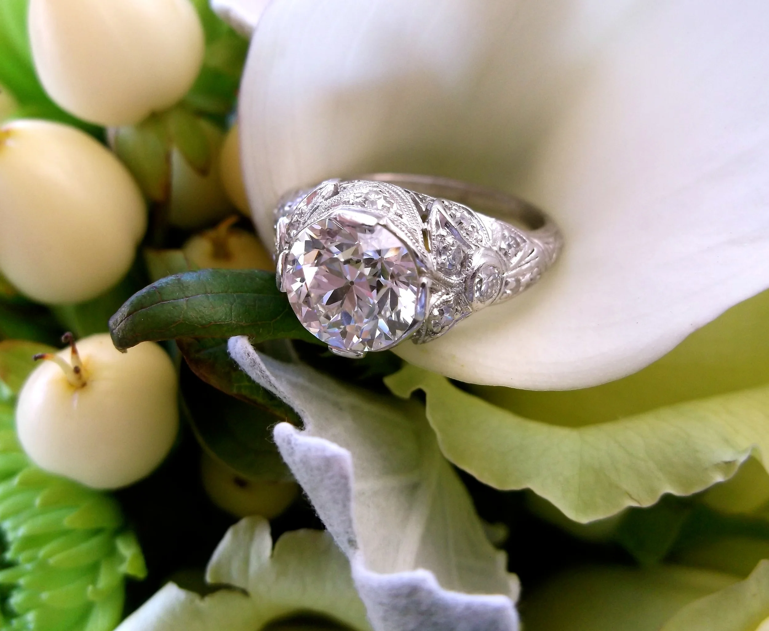 SOLD - All original 1920's 1.72 carat Old European cut diamond set in a beautiful Art Deco diamond and platinum mounting. 