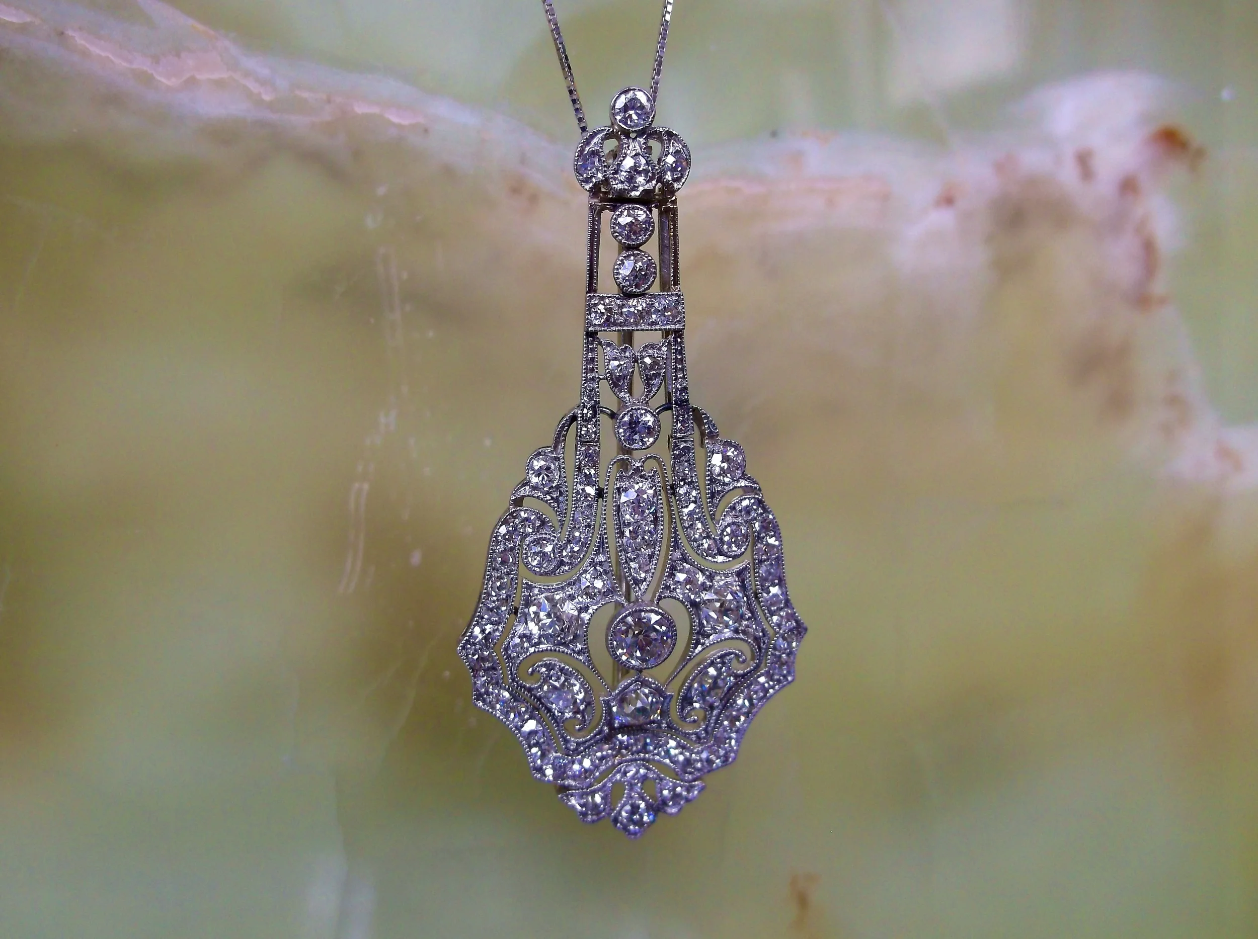 SOLD - Exquisite Art Deco diamond and platinum pendant with 2.70 carats total weight in Old European cut and single cut diamonds. (Approximately 2.0" in length.)