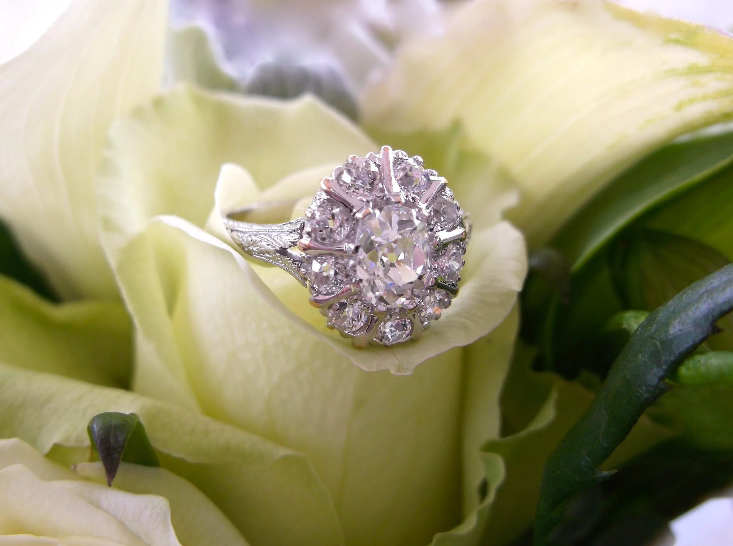 SOLD - Lovely Art Deco Old Mine cut diamond ring set in platinum with a 0.70 carat Old Mine cut diamond in the center (1.10 carats total weight in diamonds.)