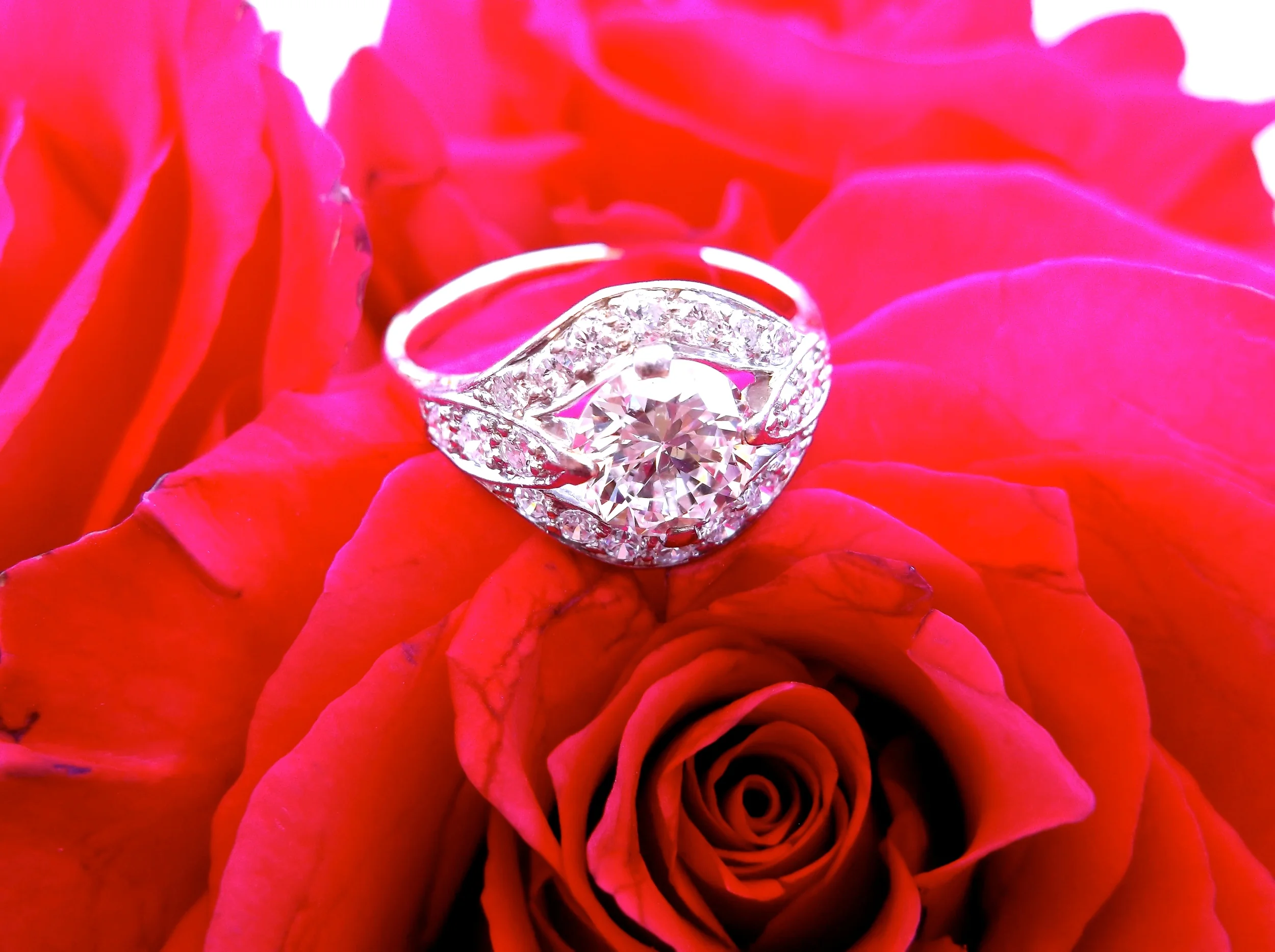 SOLD - Beautiful 1.25 carat diamond set in a yellow gold and white gold diamond detail mounting.