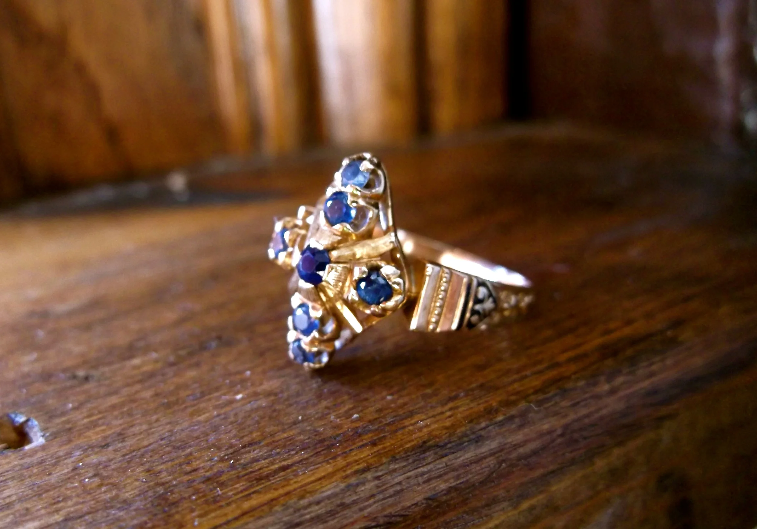SOLD - Beautiful Victorian era sapphire and yellow gold ring with lovely hand engraving and black enameling detail. 