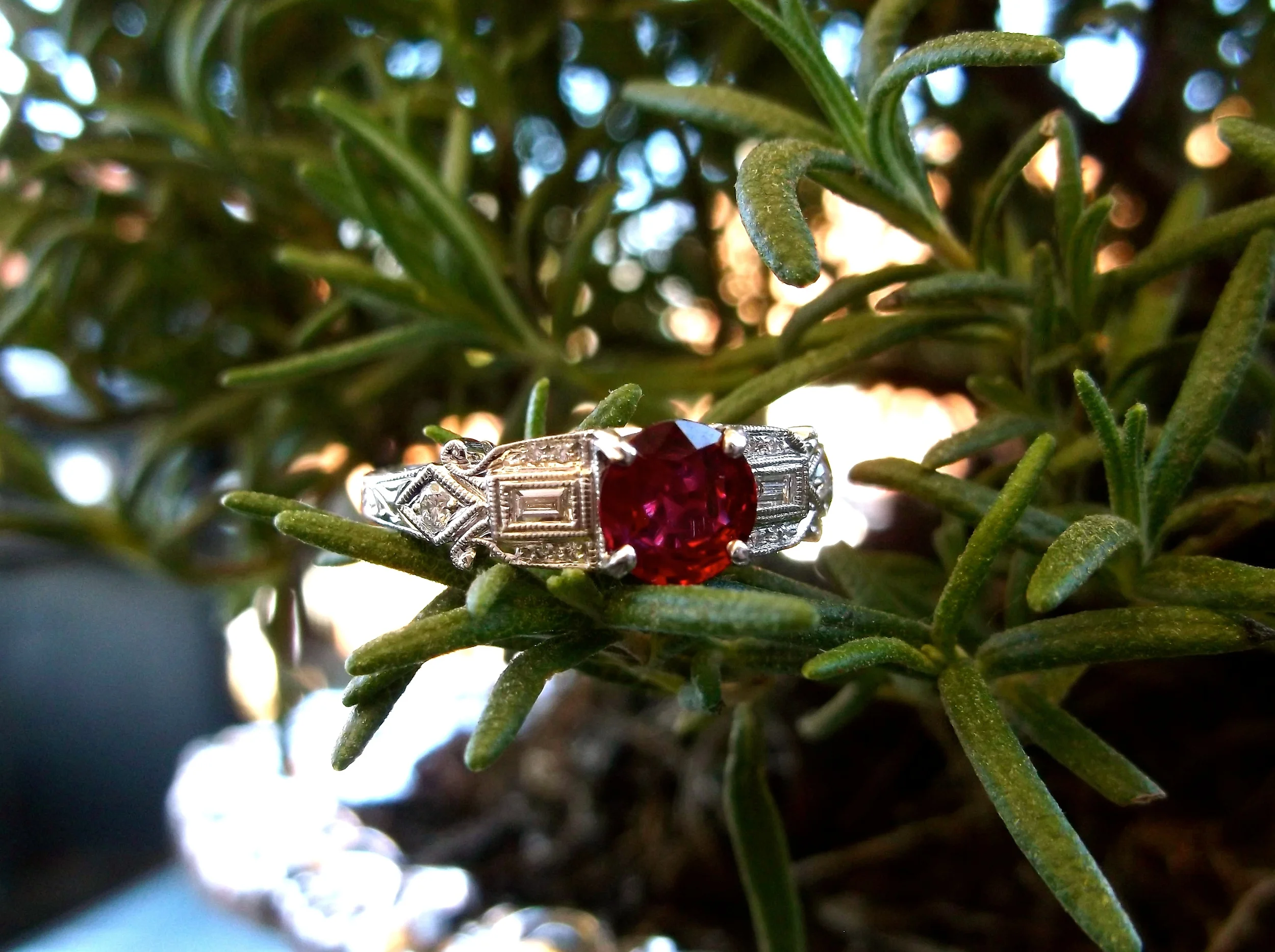 SOLD - Vibrant 0.79 carat ruby set in a diamond and white gold mounting. 
