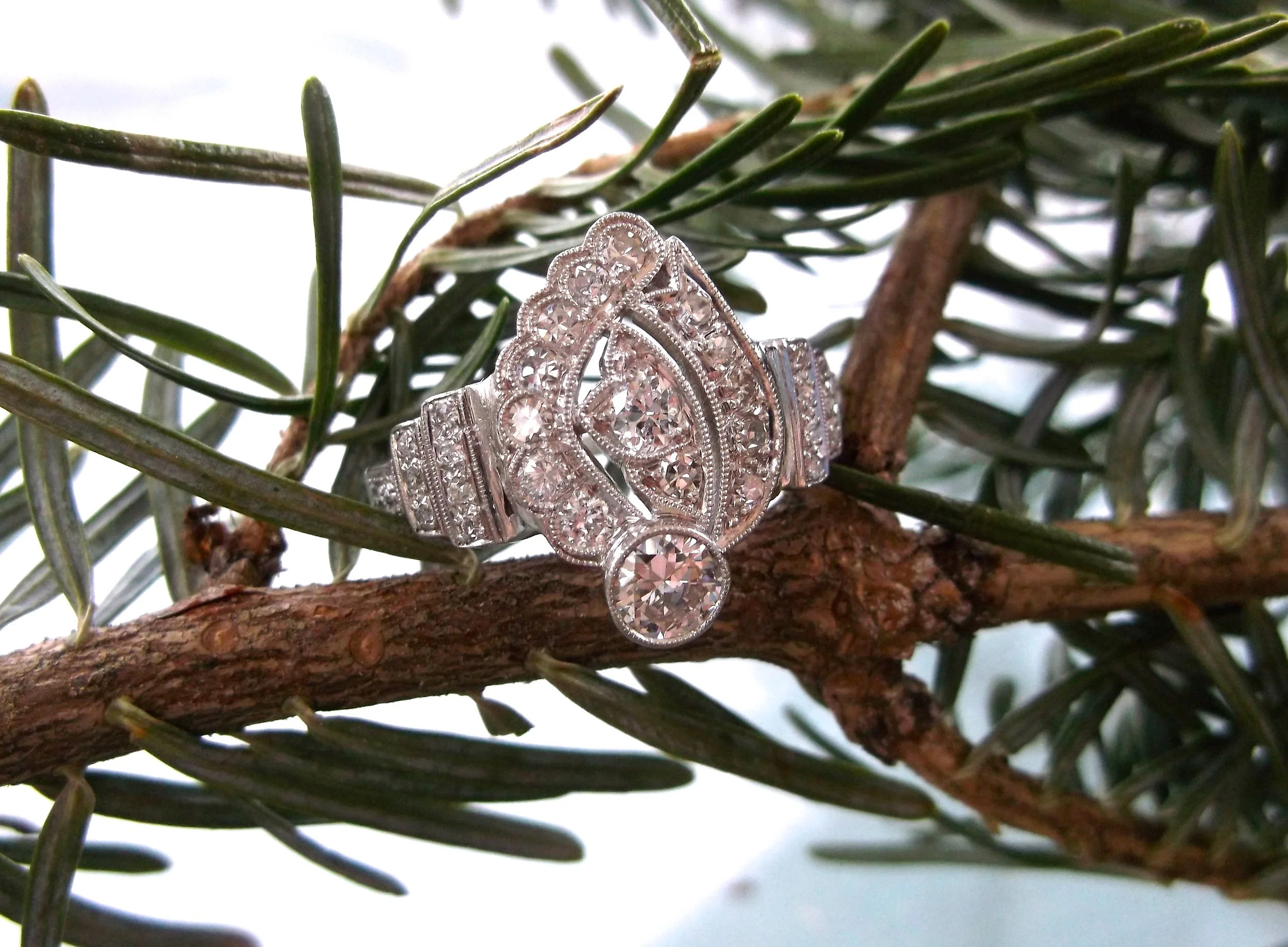SOLD - Beautiful 1920's diamond and platinum ring with a 0.35 carat Old European cut diamond in the center (0.73 carats total weight in diamonds) set in platinum. 