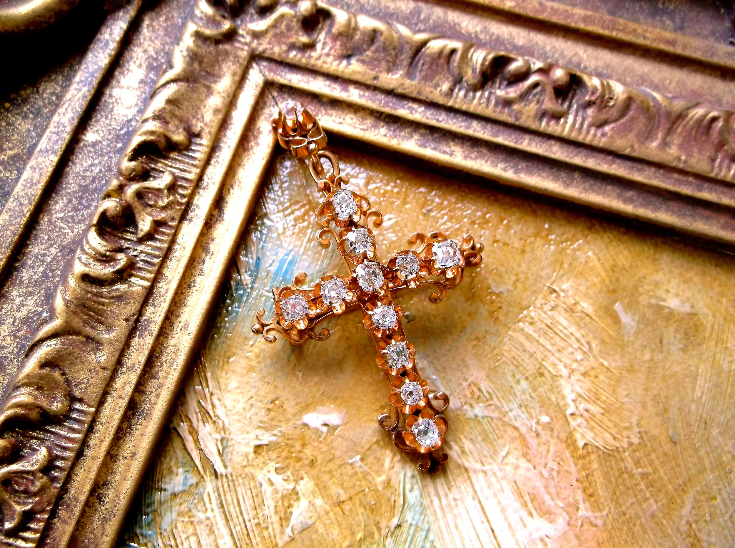 SOLD - Breathtaking Victorian era diamond cross set in yellow gold with 1.50 carats total weight in Old Mine cut diamonds. (Approximately 2.5" in length by 1.5" in width.) 
