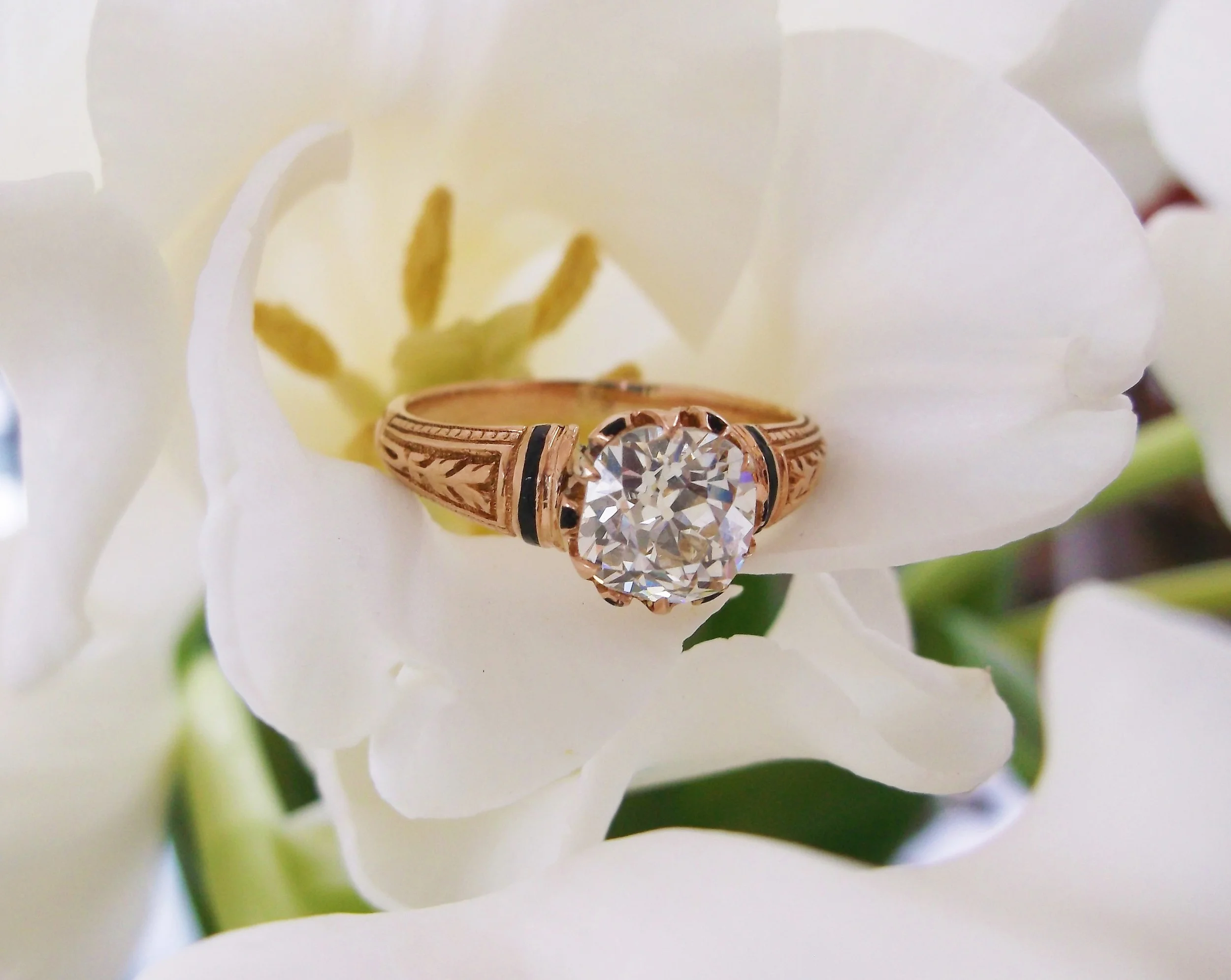 SOLD - Gorgeous Victorian Era 1.29 carat Old Mine cut diamond set in a yellow gold hand engraved mounting with black enameling detail.