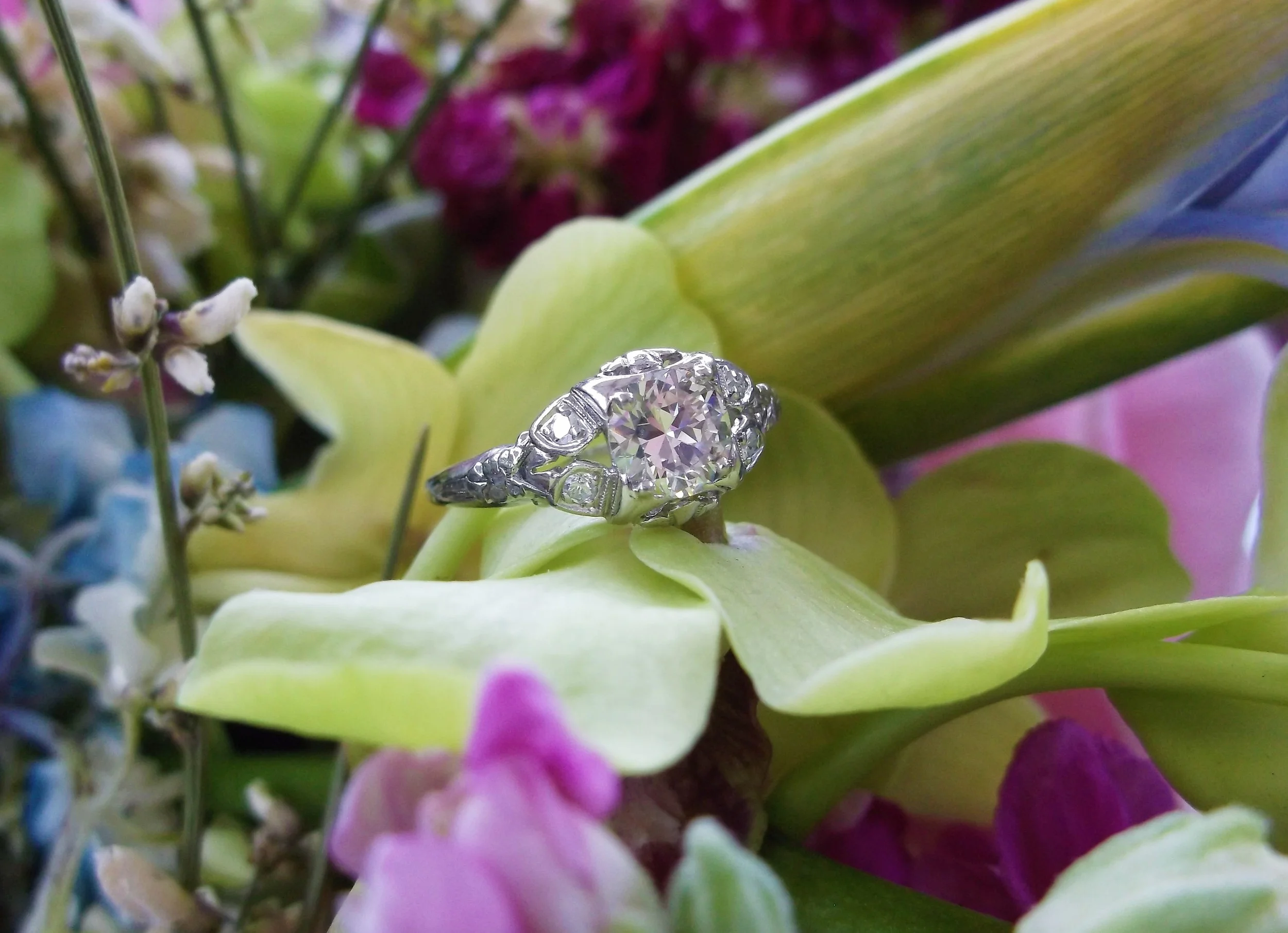 SOLD - Beautiful 1920's 0.68 carat Old European cut diamond set in a lovely platinum and diamond detail mounting.
