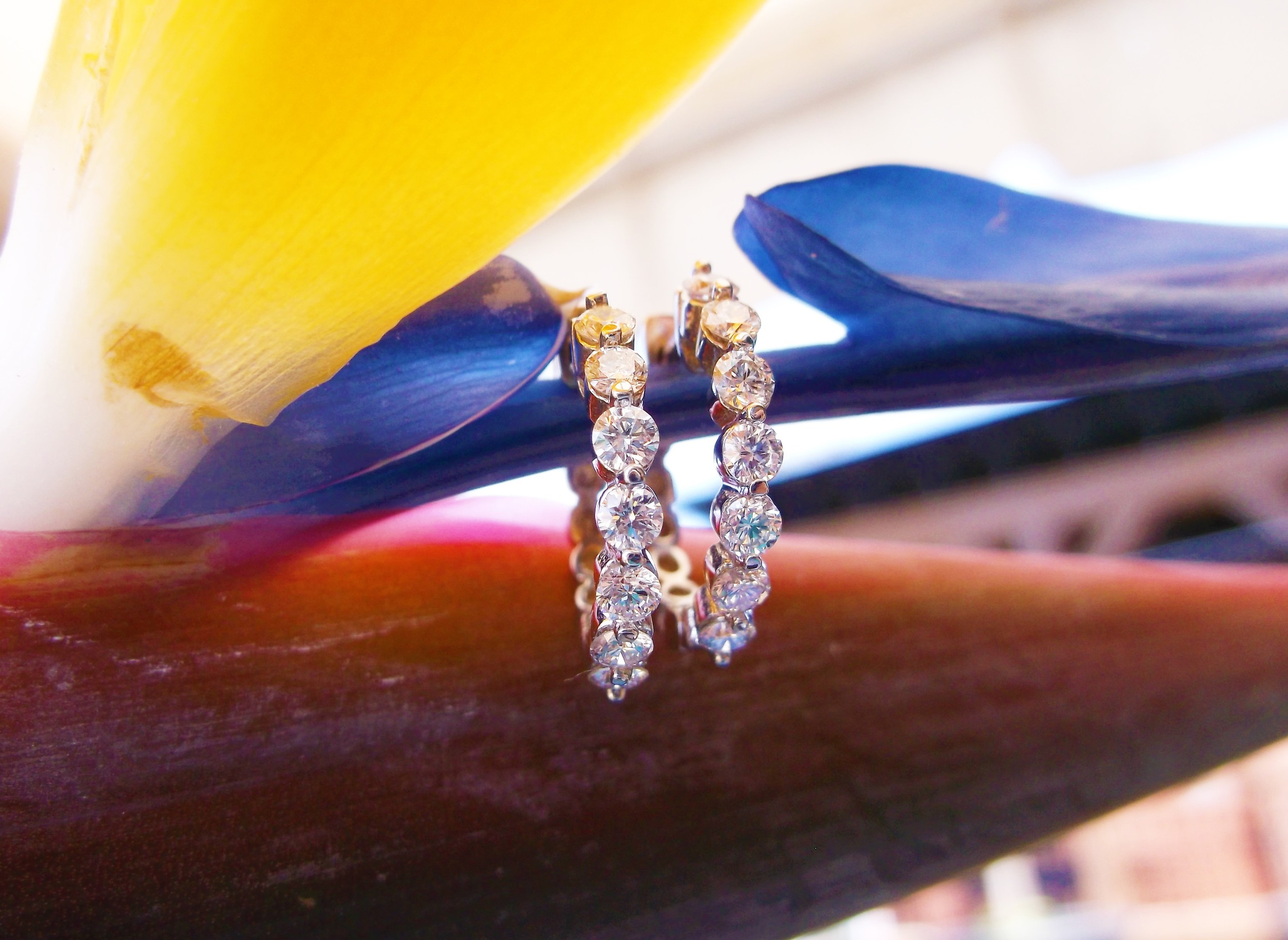 SOLD - A staple to your jewelry wardrobe! White gold diamond hoop earrings with 0.80 carats total weight in diamonds.