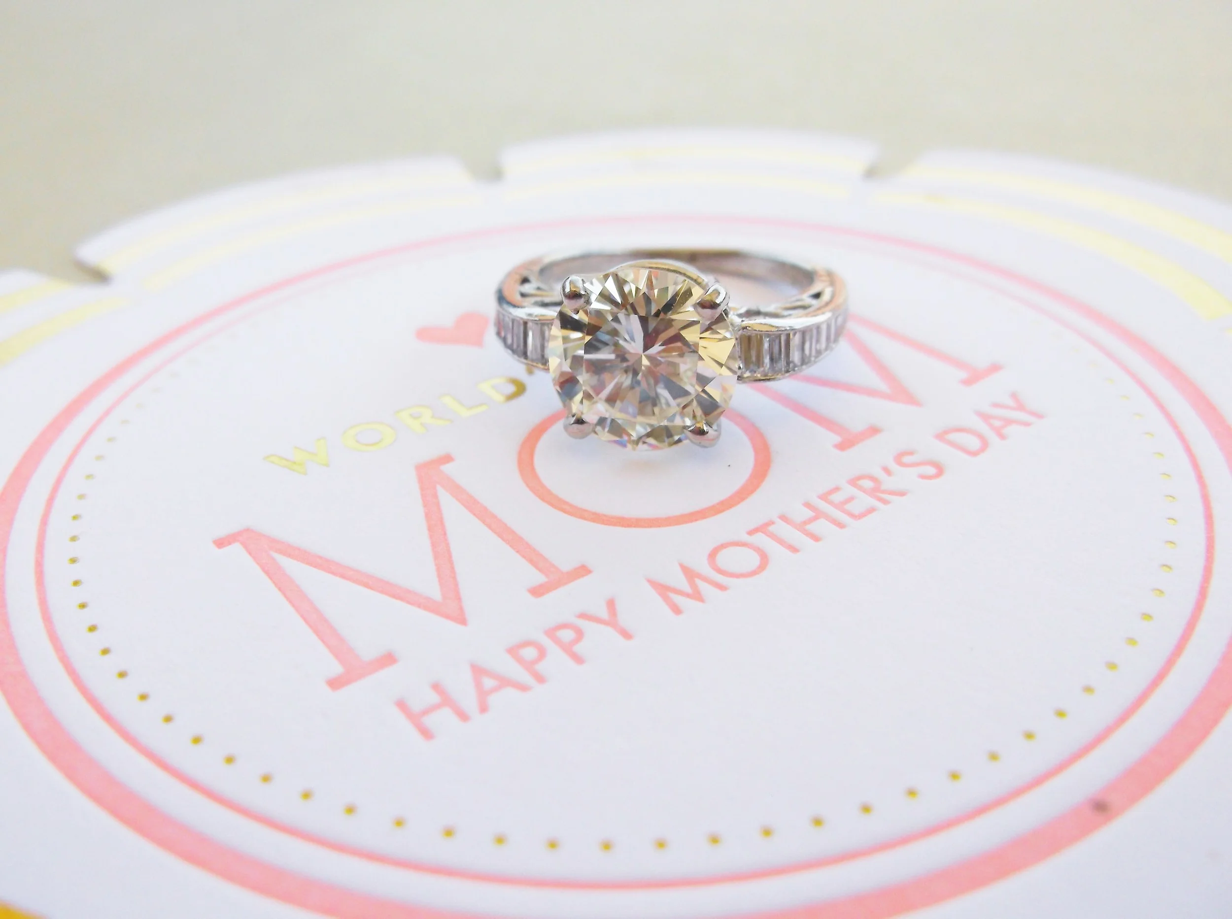 SOLD - Stunning 3.58 carat diamond set in a platinum and baguette diamond detail mounting.