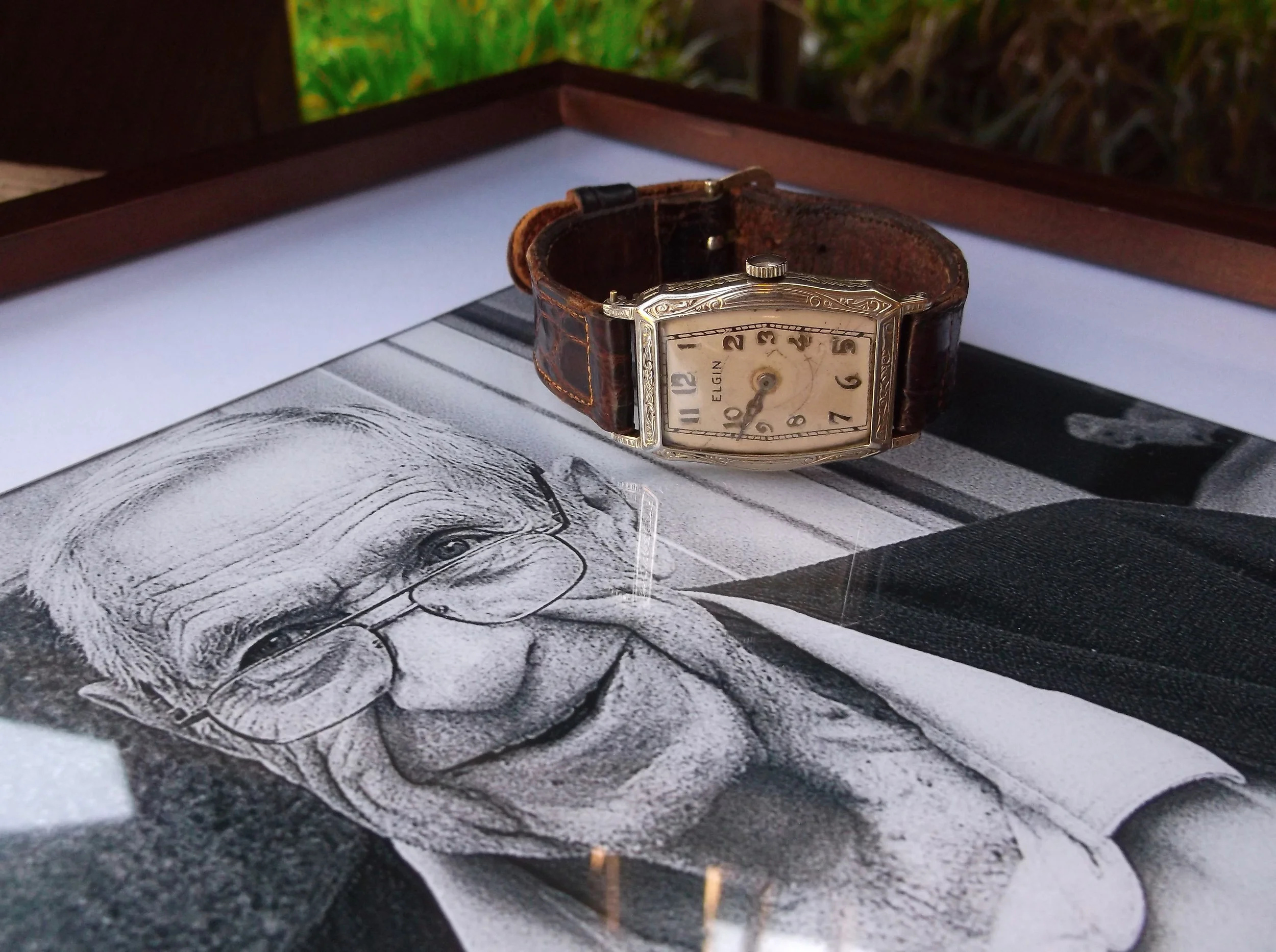 SOLD - Circa 1927 white gold, 15 jewel Elgin wristwatch with beautiful engraving detail around the face. The watch is pictured on an image taken by Nashville photographer, Timothy Ditzler, of Jack Walton, husband to Melba Walton who started Walton's Jewelry 41 years ago! We stumbled upon the photo of Mr. Walton on Instagram and Timothy was so kind to bring us a framed copy! (Fun fact, Mr. Walton was born the same year that his watch was made!)