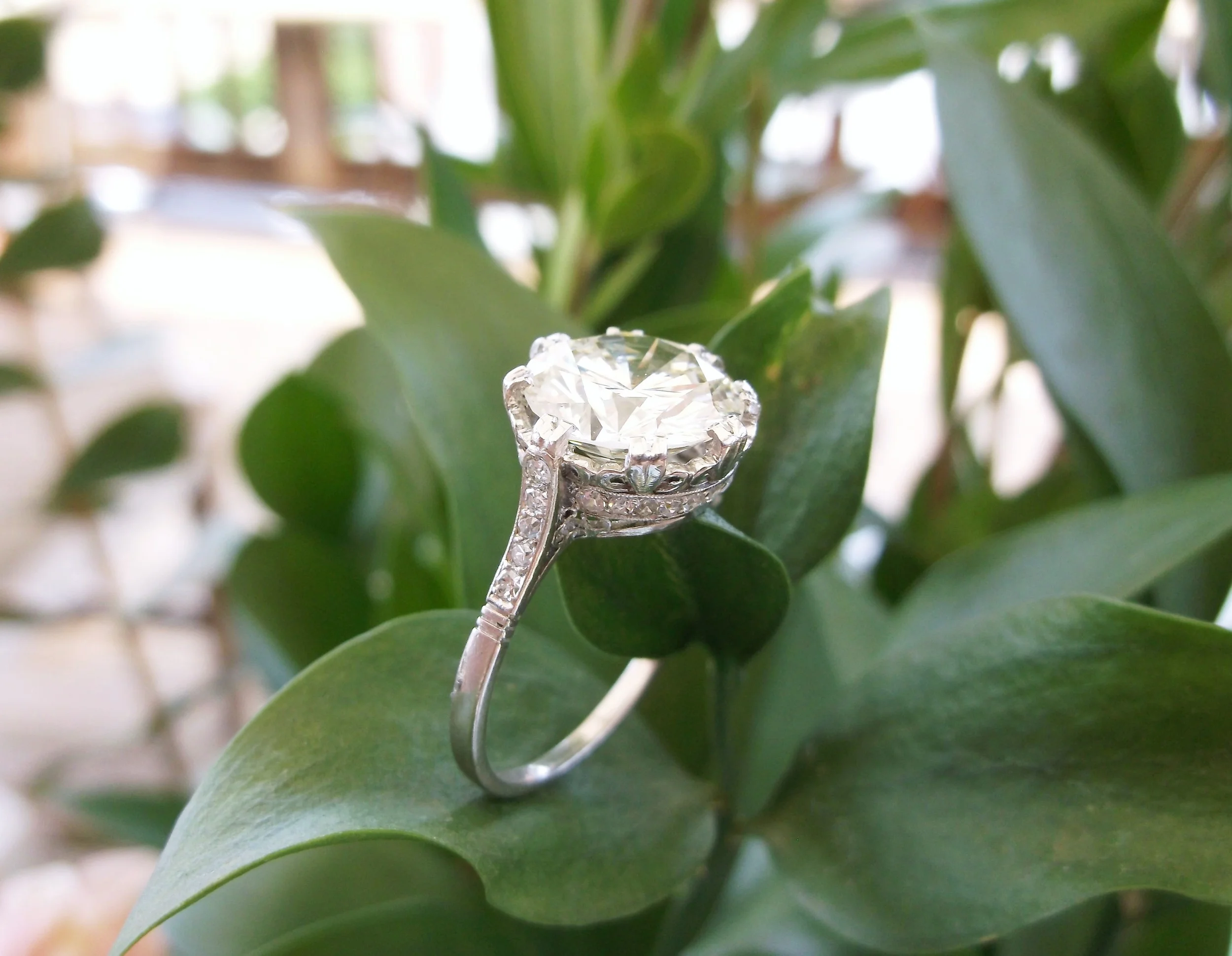 SOLD - Jaw dropping 3.58 carat round diamond set in a stunning Art Deco diamond and platinum mounting.