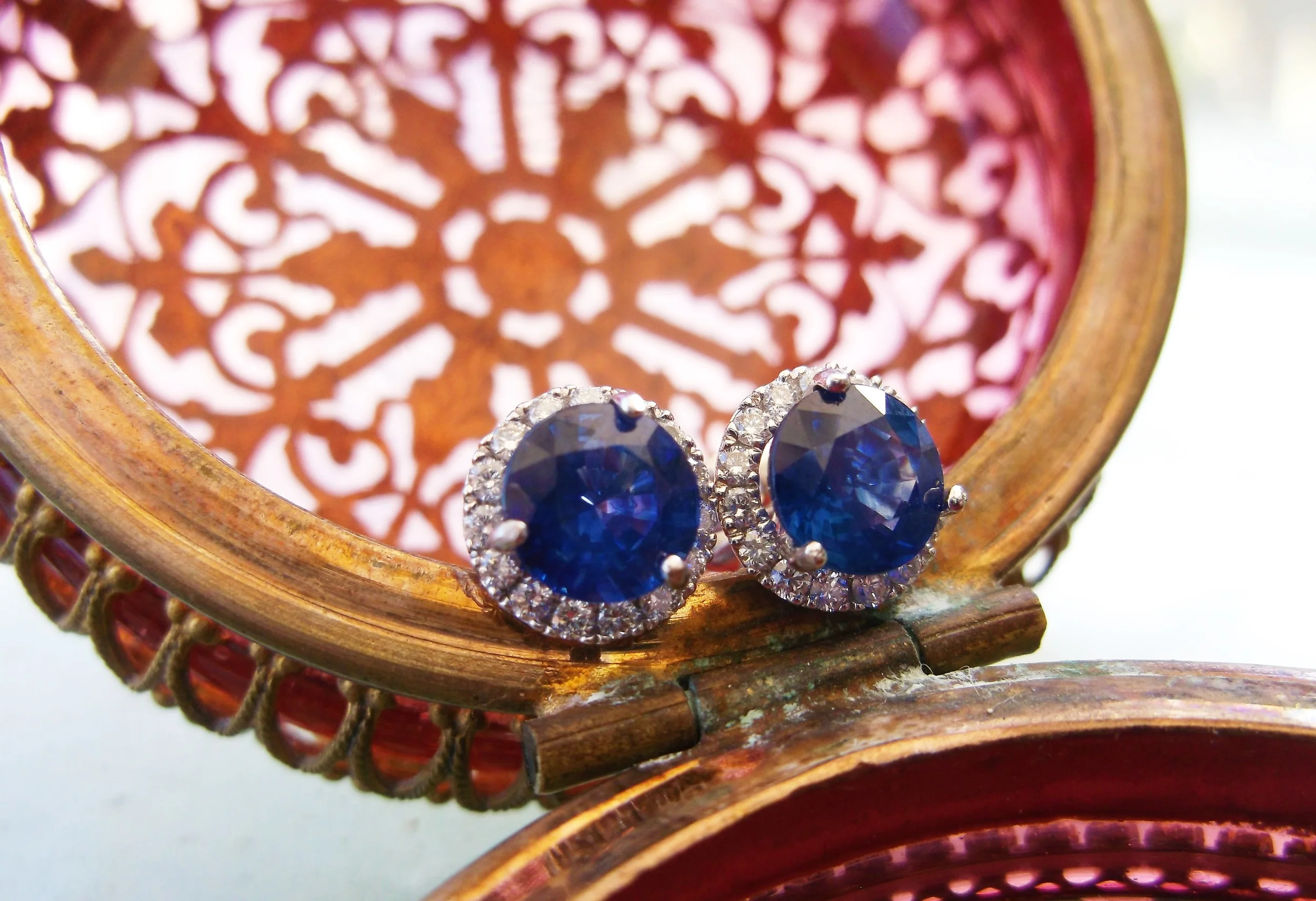 SOLD - Beautiful diamond and sapphire stud earrings with a 1.00 carat sapphire set in each.