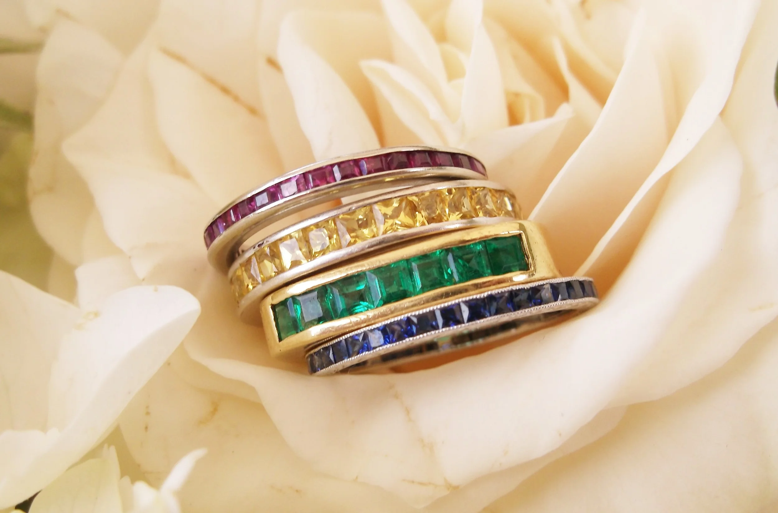 Lovely ruby and platinum, yellow sapphire and white gold, emerald and yellow gold and sapphire and platinum bands.