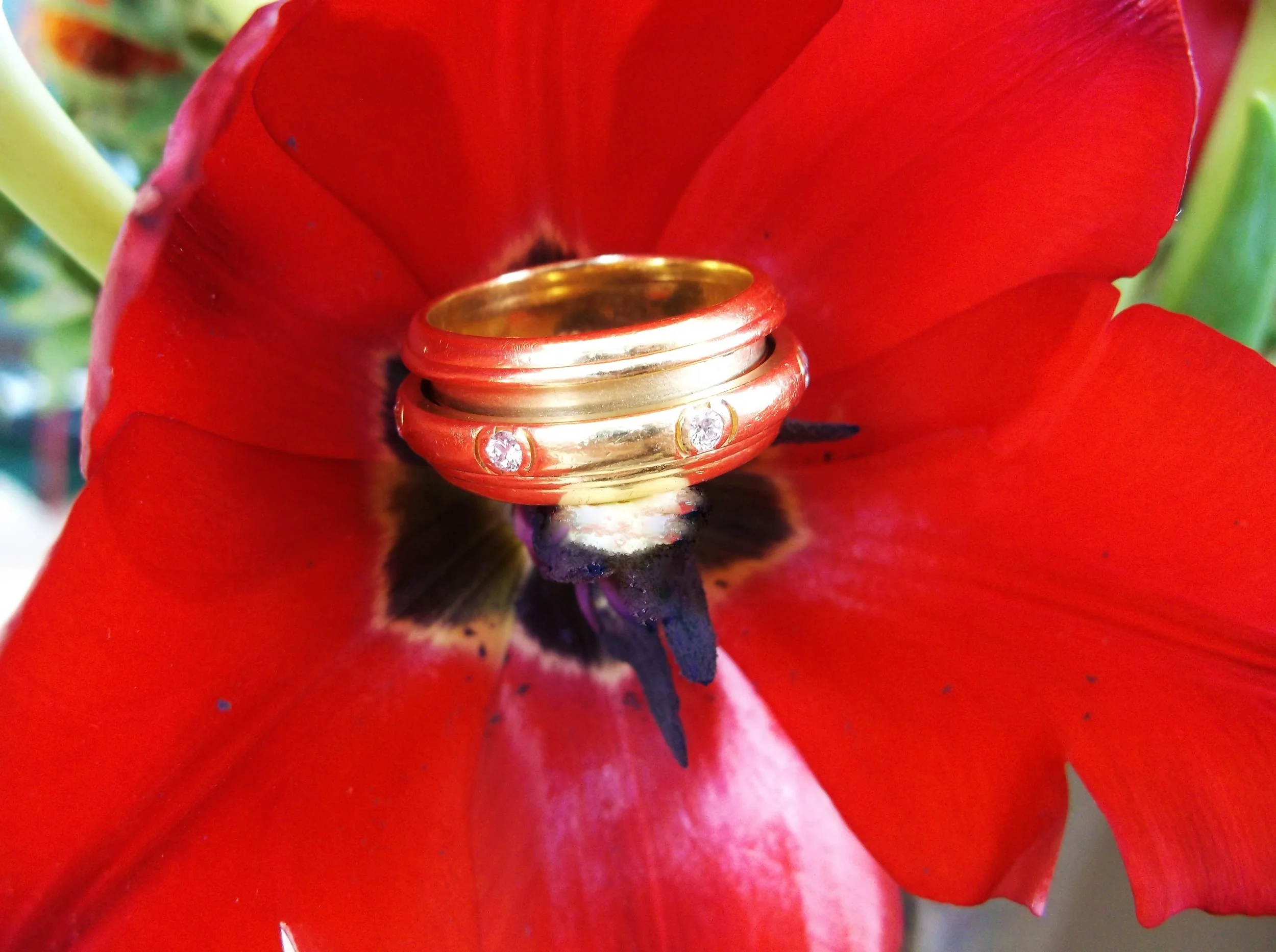 SOLD - Beautiful signed Piaget "Possession" 18K yellow gold and diamond ring with 0.35 carats total weight in diamonds. The center portion with the diamonds turns with the movement of your hand!