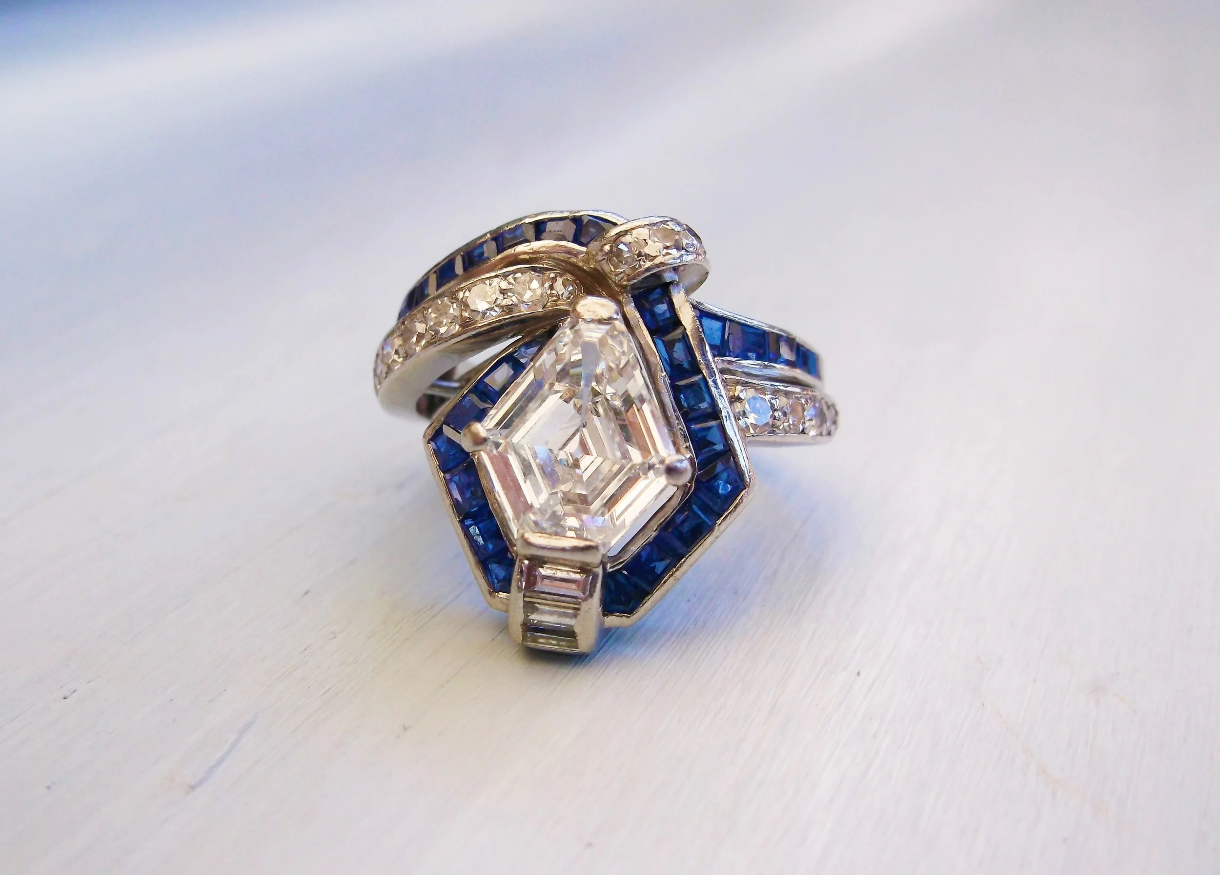 SOLD - Exquisite 1920's diamond, sapphire and platinum ring that features a gorgeous 2.07 carat kite shaped diamond!