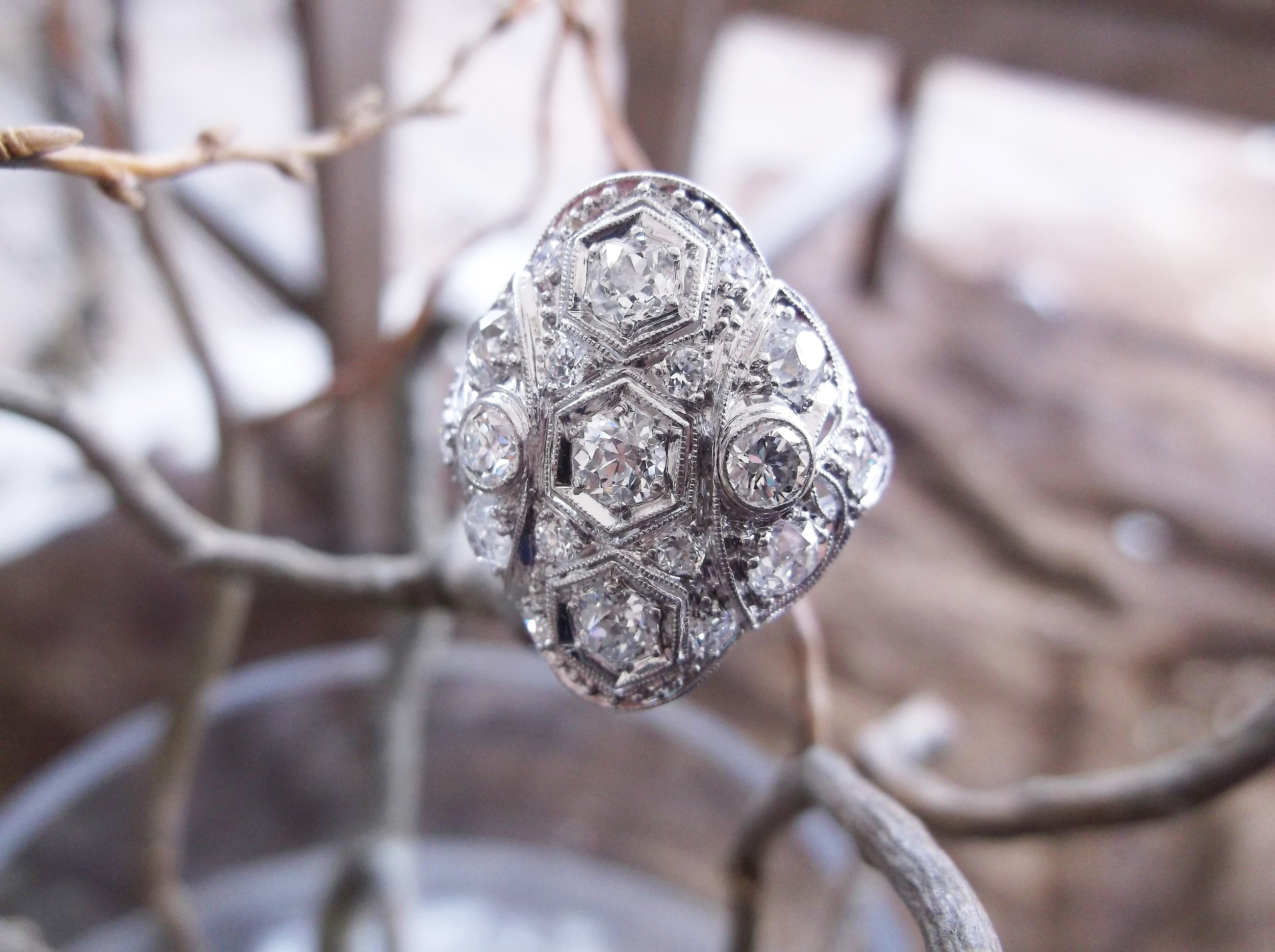 SOLD - The ultimate statement piece! 1.65 carats total weight in Old Mine cut diamonds set in platinum, circa 1920's.