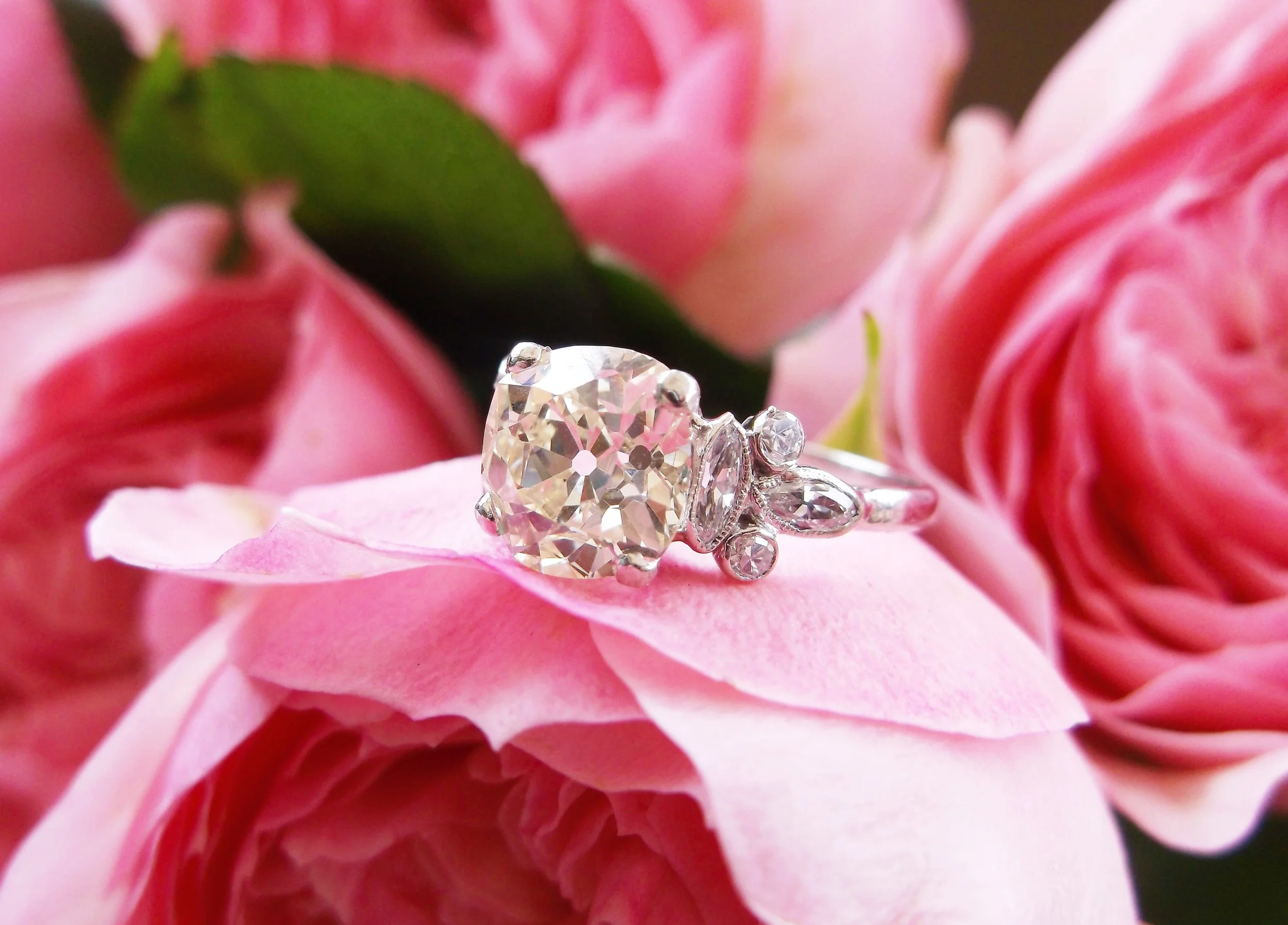 Ravishing 2.38 carat Old Mine cut diamond set in a lovely diamond and platinum mounting.