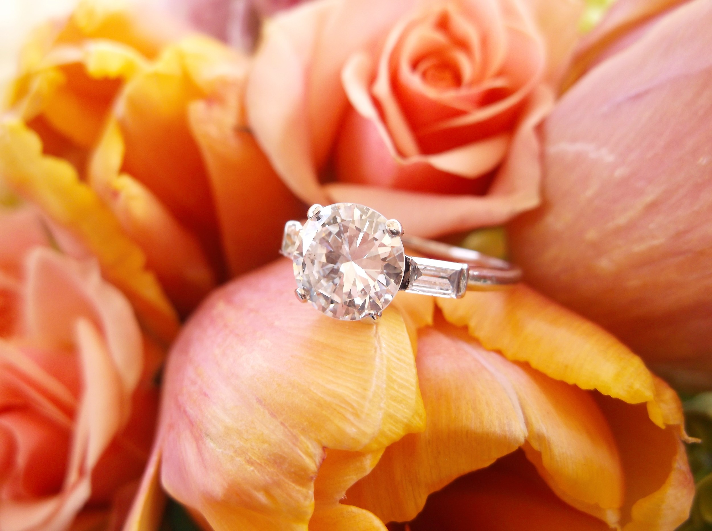 SOLD - Iconic 1.80 carat Old European cut diamond with a baguette cut diamond on each side, set in platinum.
