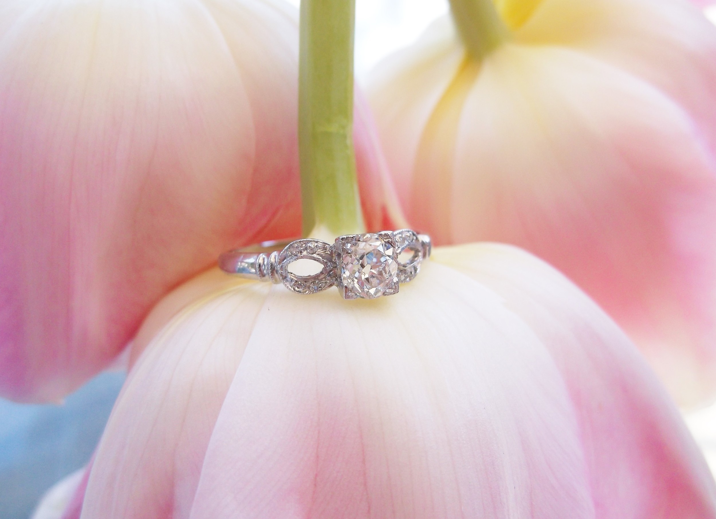 SOLD - Darling Art Deco and platinum diamond ring with a 0.50 carat Old Mine cut diamond in the center. 