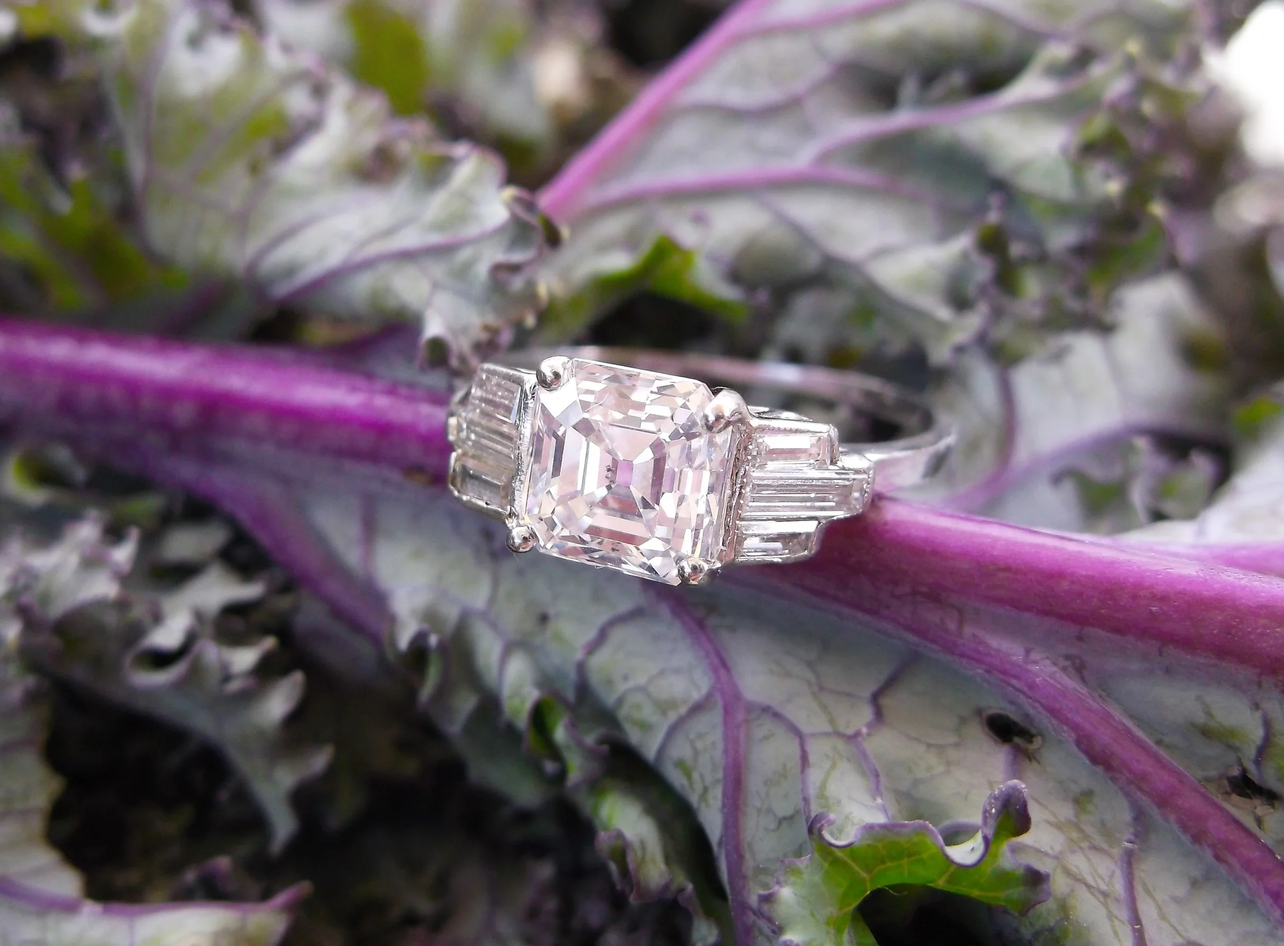 SOLD - Sophisticated Art Deco 1.13 carat asscher cut diamond, flanked by three baguette cut diamonds on each side.